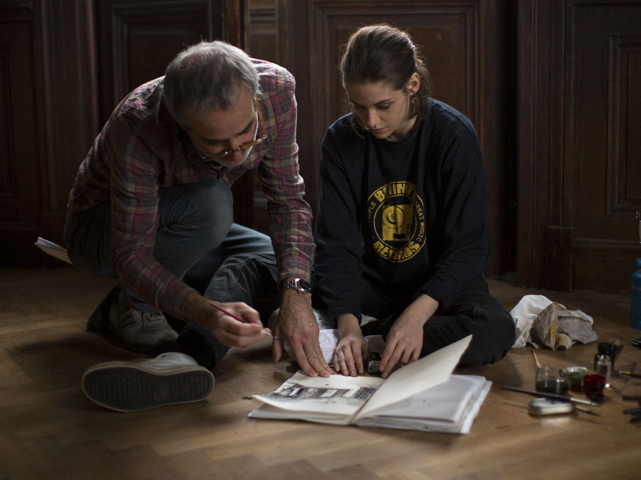 The film director Olivier Assayas and Kristen Stewart on set of 'Personal Shopper'