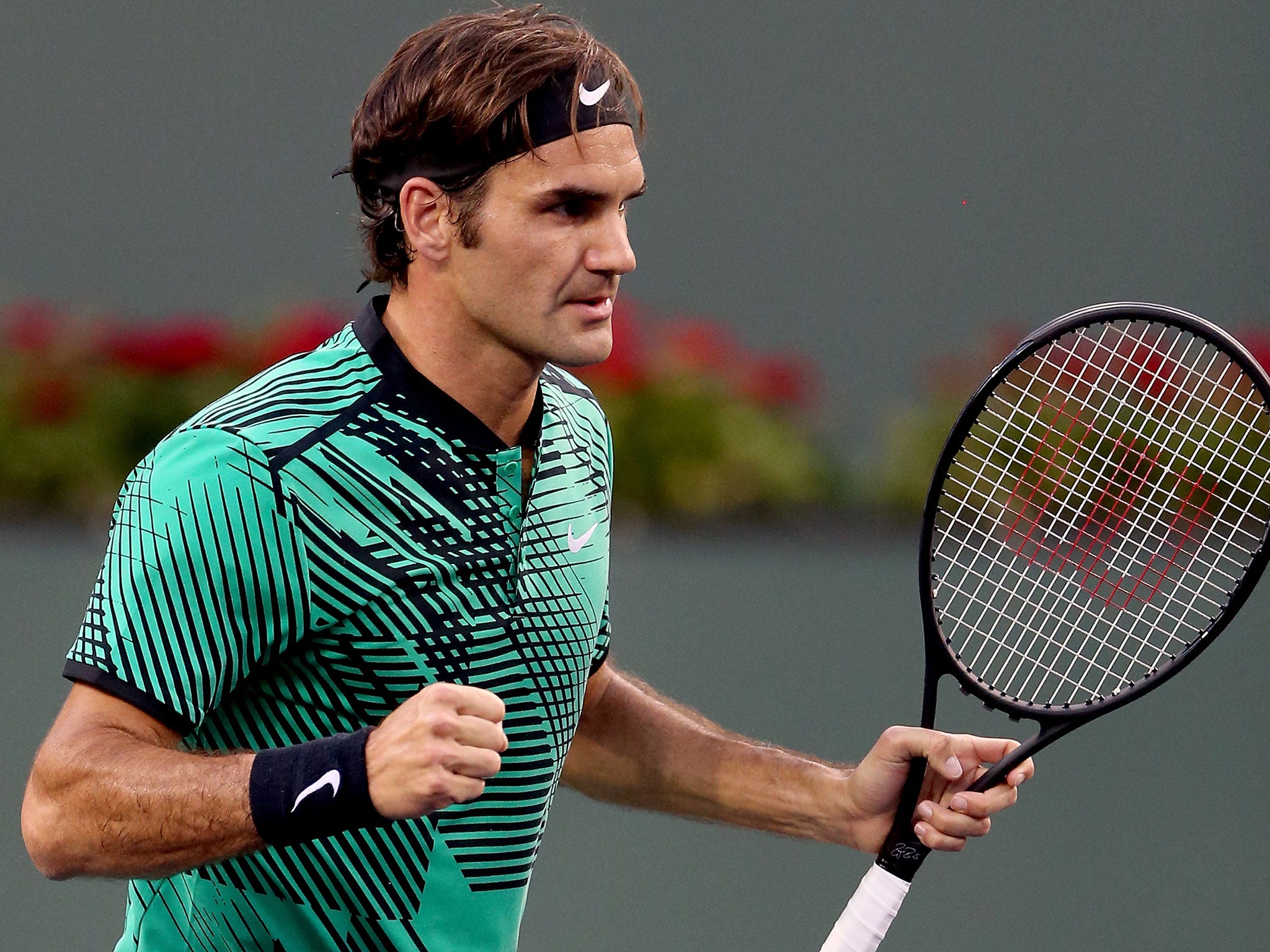 Roger Federer beat Steve Johnson in straight sets to set-up a quarter-final clash with Rafael Nadal