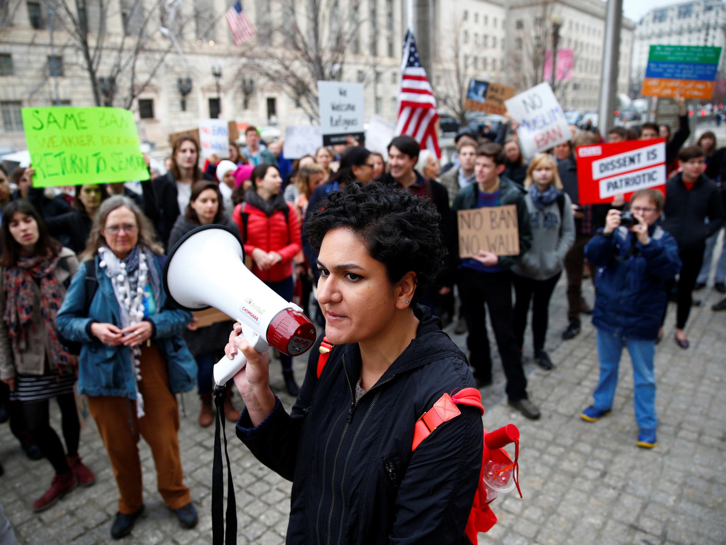 Immigration activists, including members of the DC Justice for Muslims Coalition, rally against the Trump administration's new ban against travelers from six Muslim-majority nations outside of the US Customs and Border Protection headquarters in Washington