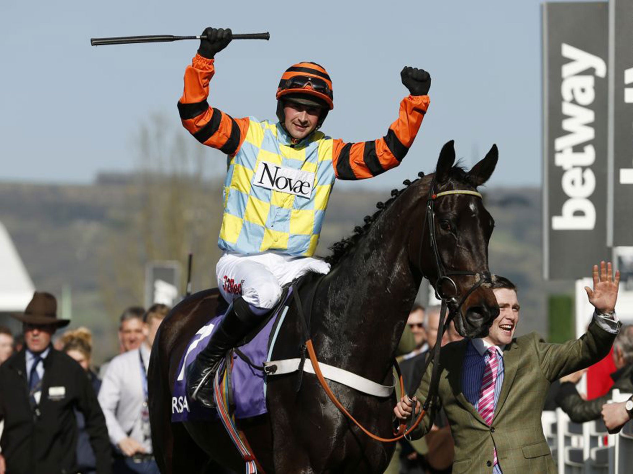 Nico De Boinville celebrates after riding Might Bite to victory in the RSA Novices' Chase