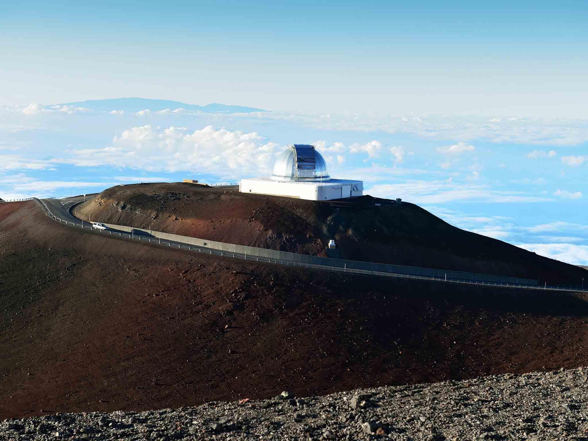 Spot one? On the ascent to the top of Hawaii’s Mauna Kea volcano is a signpost warning of ‘invisible cows’