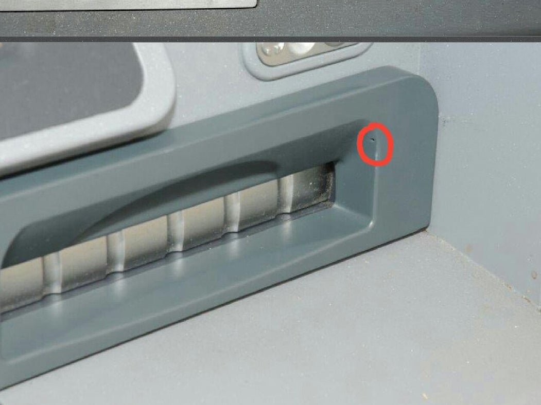 The camera hole is barely visible but allows fraudsters to film people entering their pin number