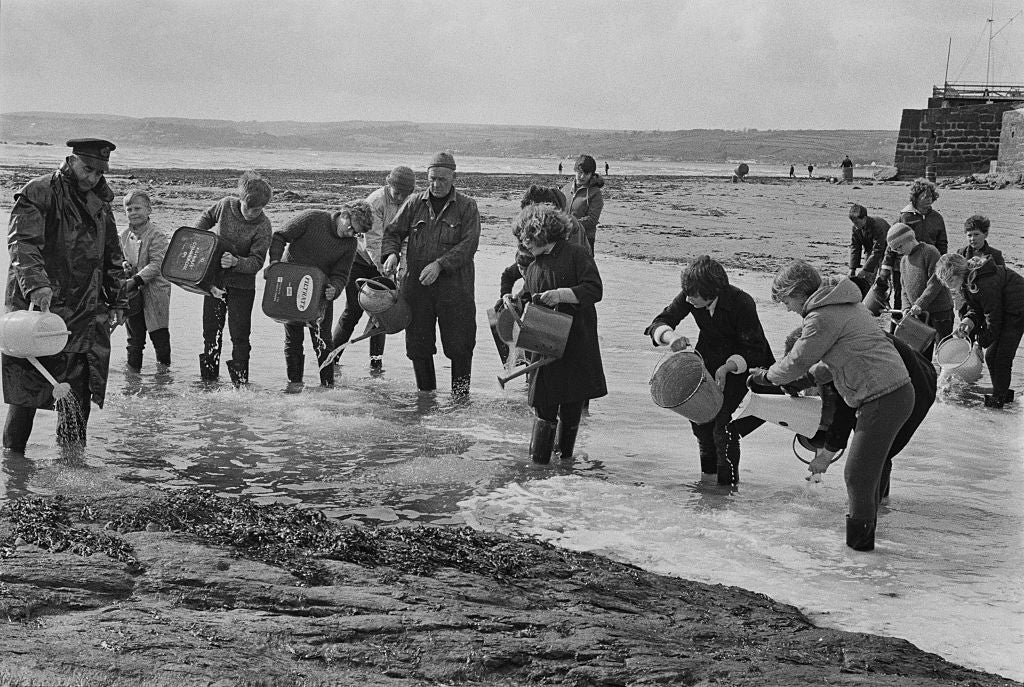 There was a swift community response to the spill, with volunteers racing to disperse the oil on the beach at Marazion