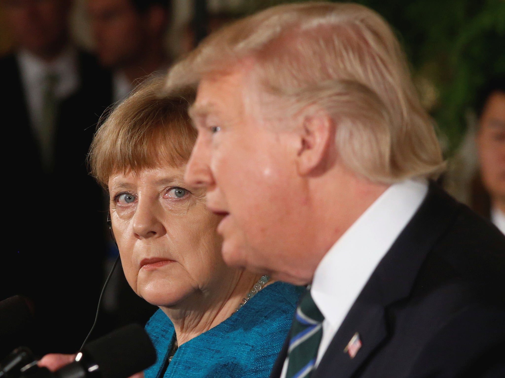 Germany's Chancellor Angela Merkel and US President Donald Trump hold a joint news conference in the East Room of the White House