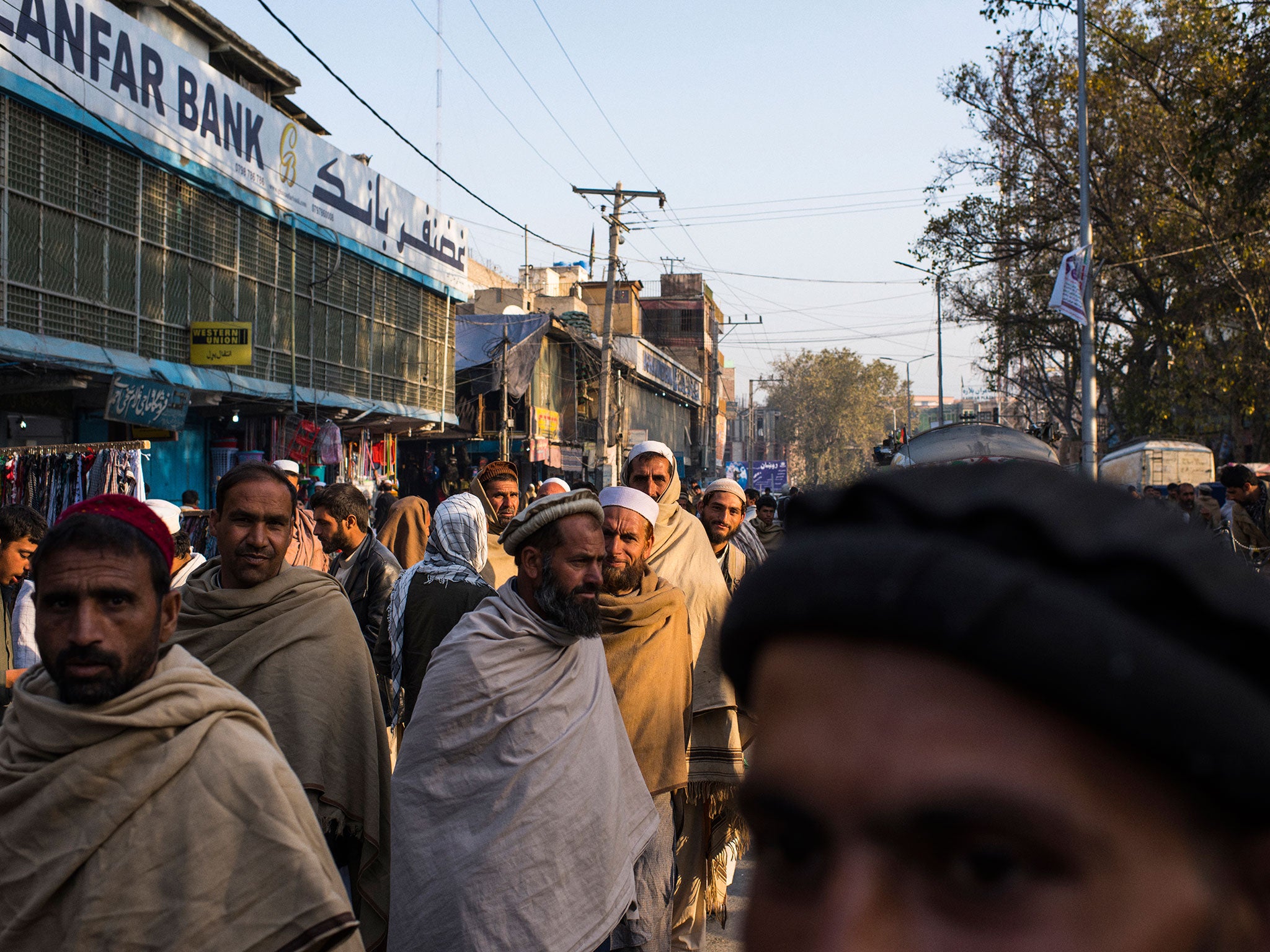 &#13;
Afghan refugees in Jalalabad, hoping to find a day job. Work for daily wages of $8 is difficult to find &#13;