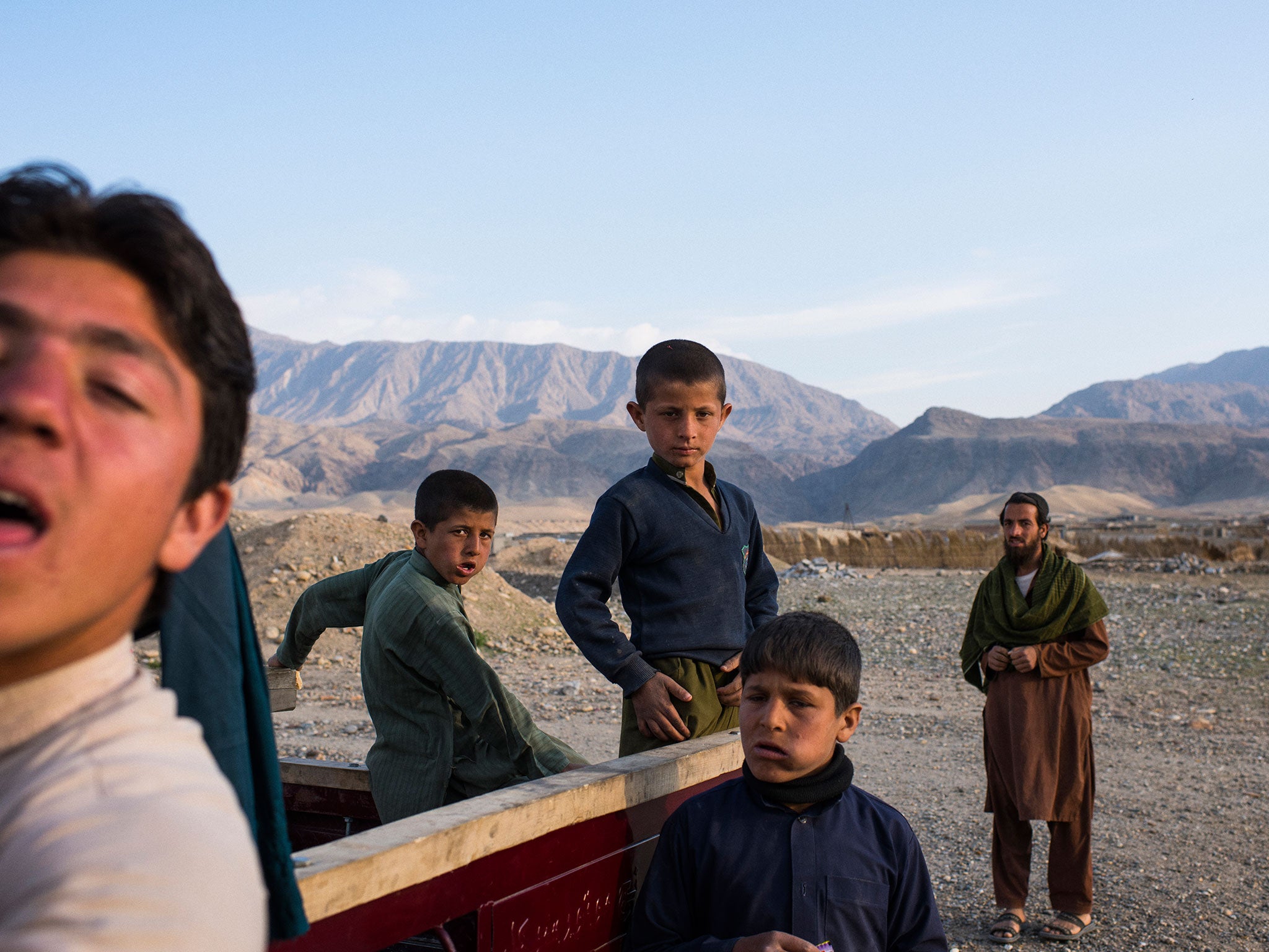 &#13;
Boys in Karokhel, a settlement of about 500 families forced from their homes &#13;