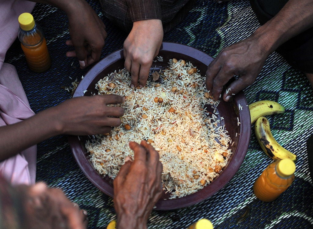 The left hand is traditionally discouraged at the table because it is considered the ‘non-sacred’ hand (AFP/Getty)