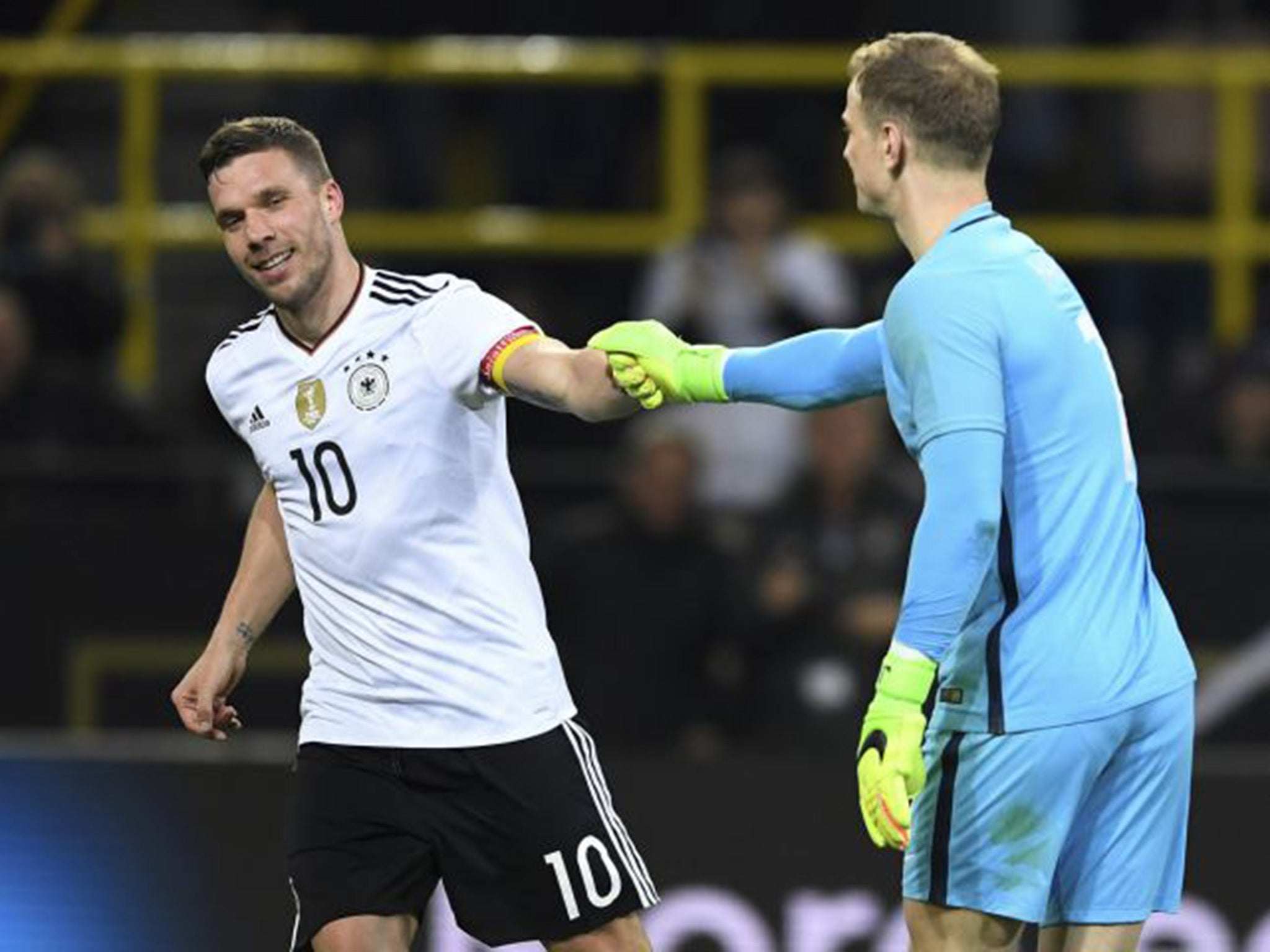 Lukas Podolski and Joe Hart shared a moment after the striker's wonder goal