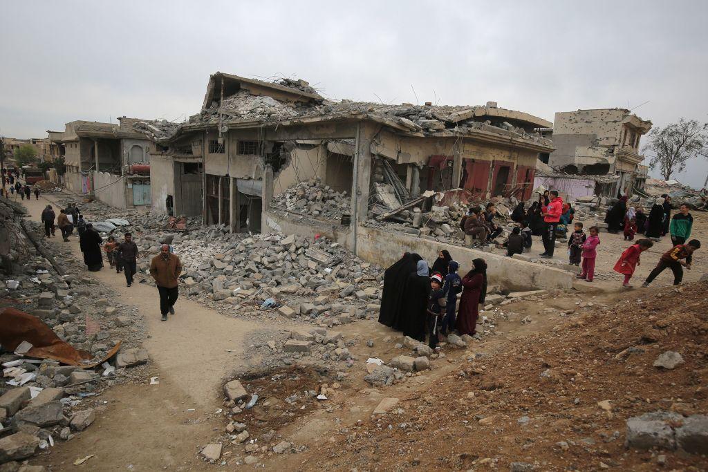 Iraqis displaced by fighting flee to the Al-Sumoud neighbourhood of Mosul on March 22, 2017