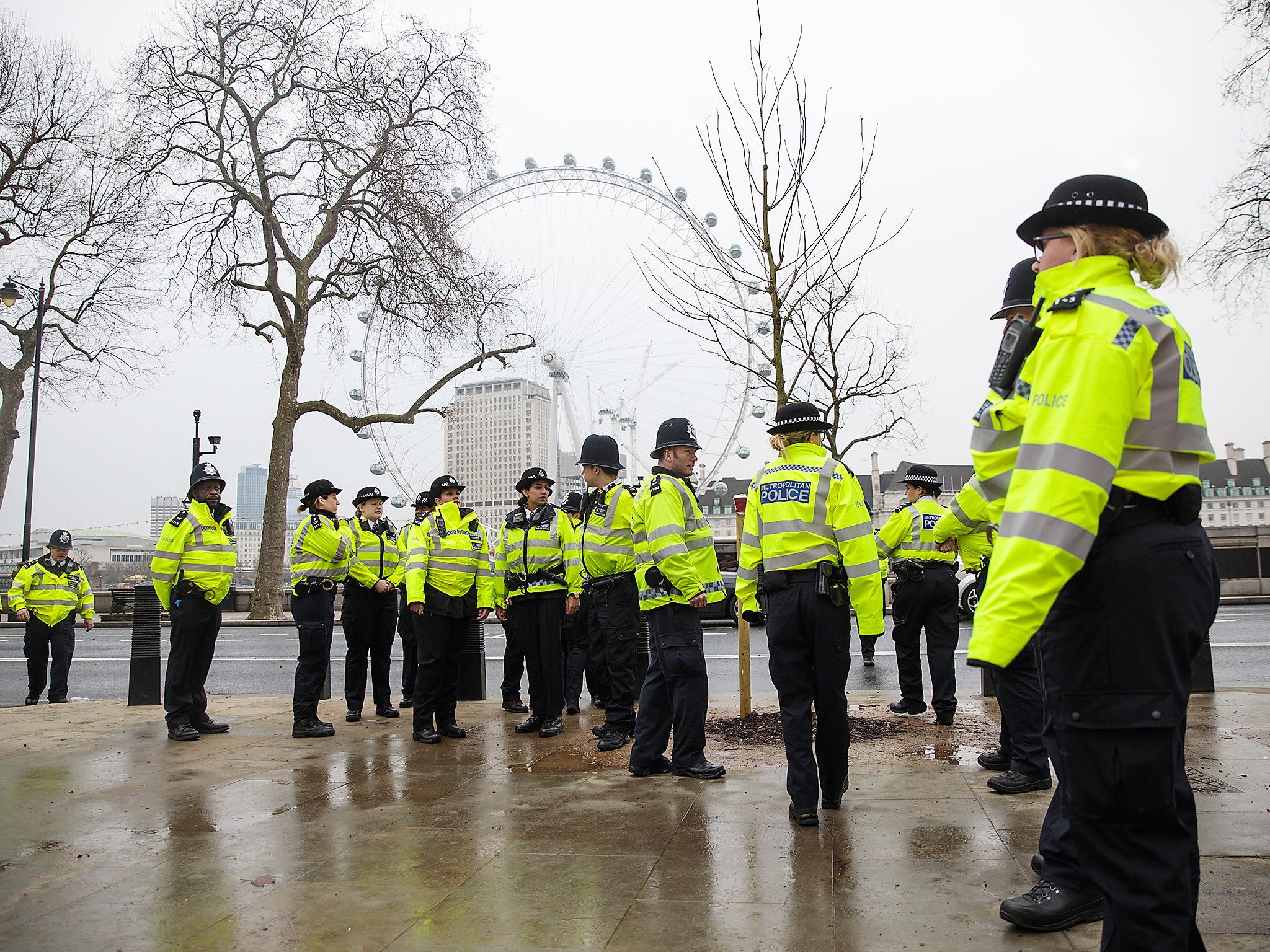 Police officers assemble on Victoria Embankment following yesterday's attack in London, England