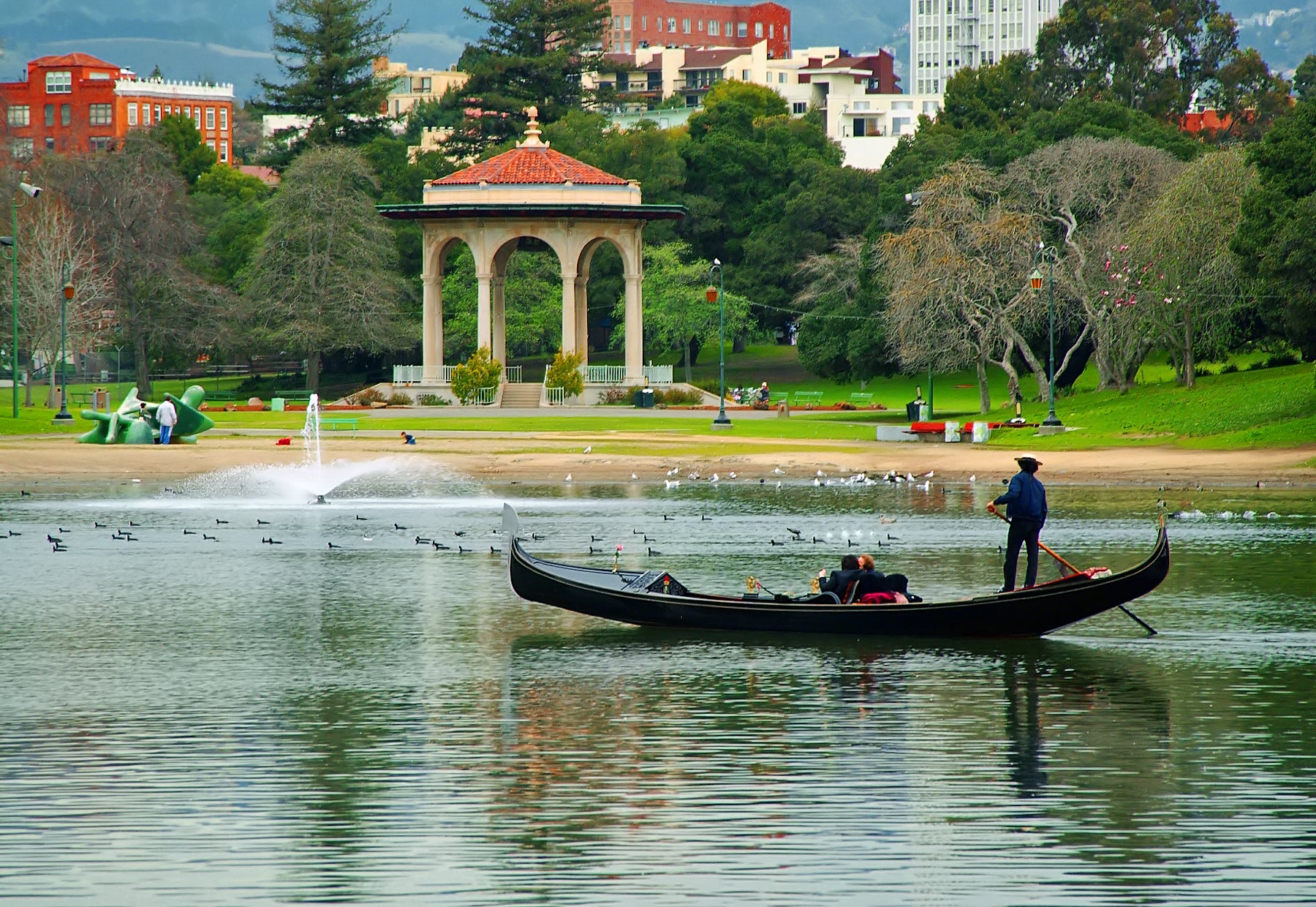 Hire a gondola for a tour of Lake Merritt