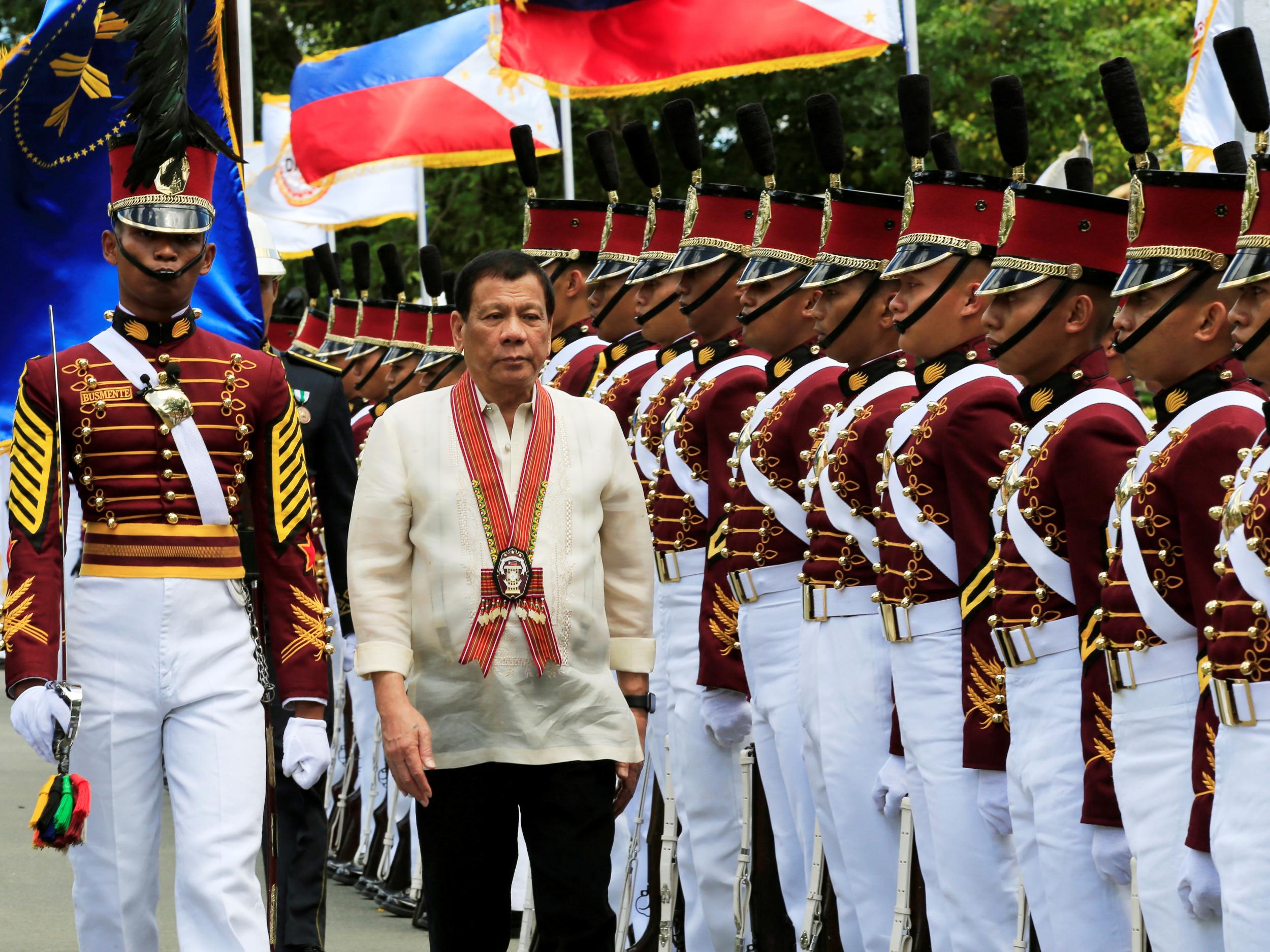 President Rodrigo Duterte reviews police academy graduates at the Philippine National Police Academy in Cavite, Philippines, on March 24 2017