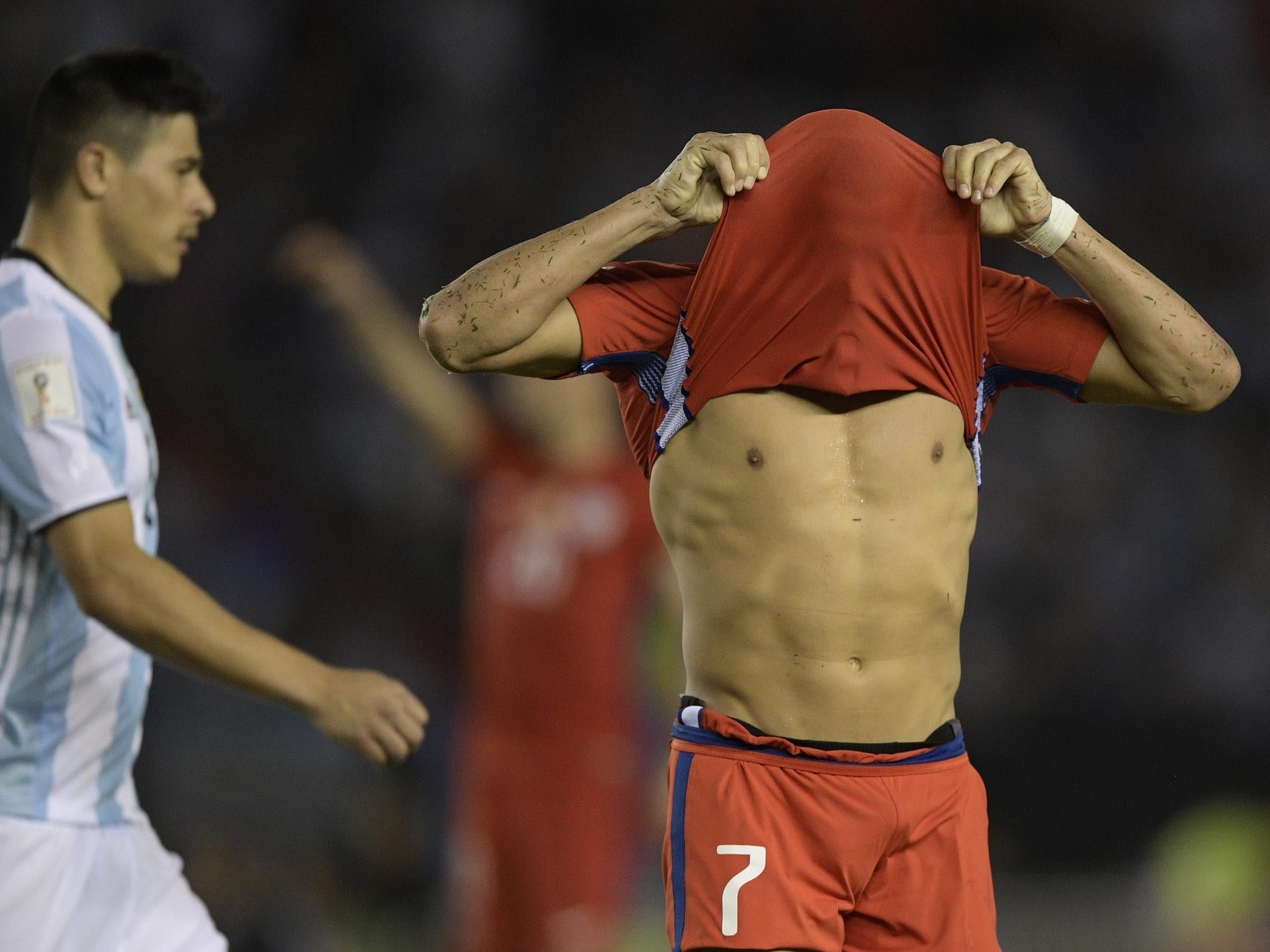 The striker pulled his shirt above his head after the final whistle.