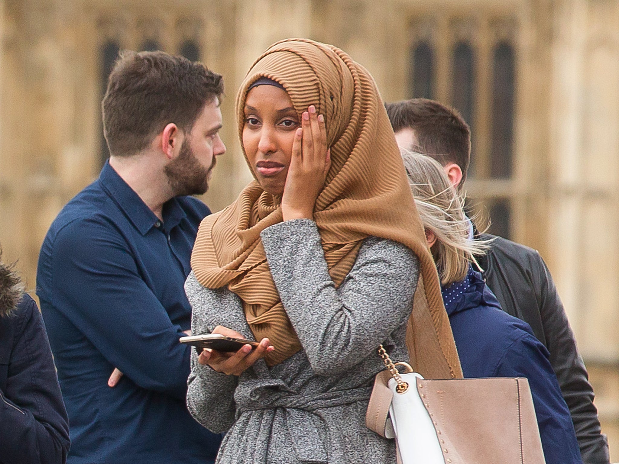 Sequence frame showing a woman visibly distressed passing the scene of the terrorist incident on Westminster Bridge, London.