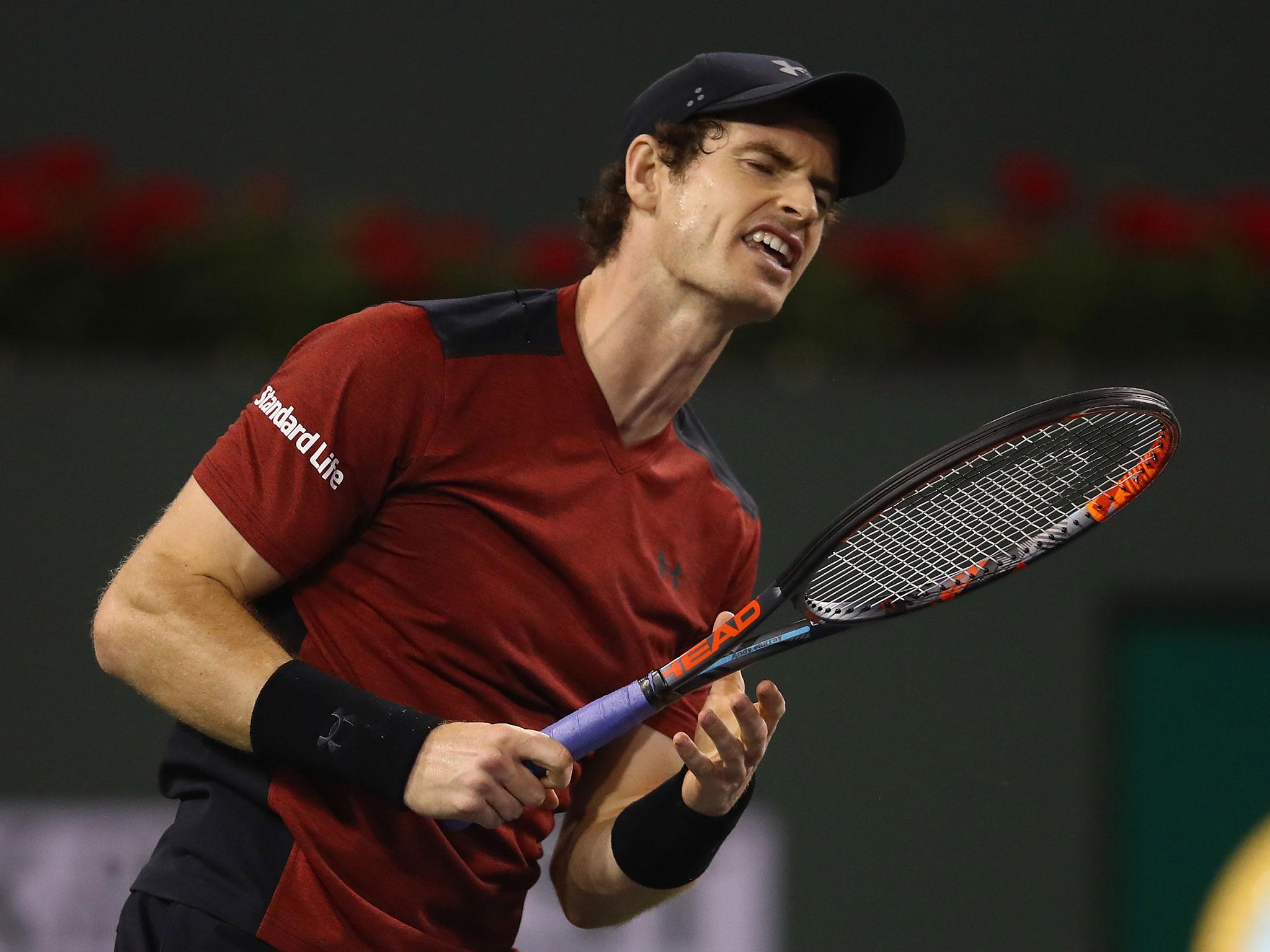 Andy Murray of Great Britain shows his frustration during his straight sets defeat by Vasek Pospisil of Canada in their second round match during day six of the BNP Paribas Open at Indian Wells