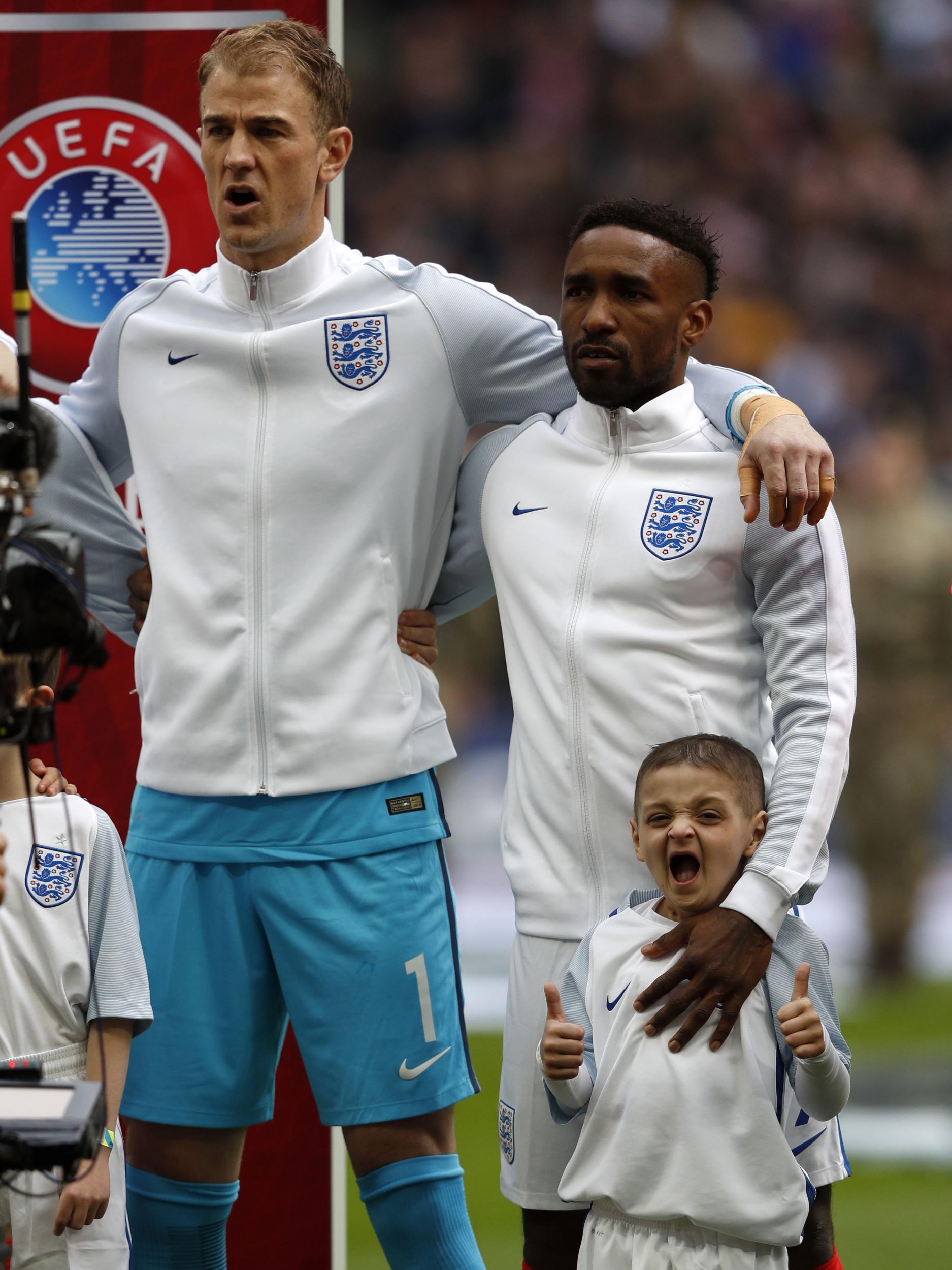 Defoe walked out with England mascot Bradley Lowrey