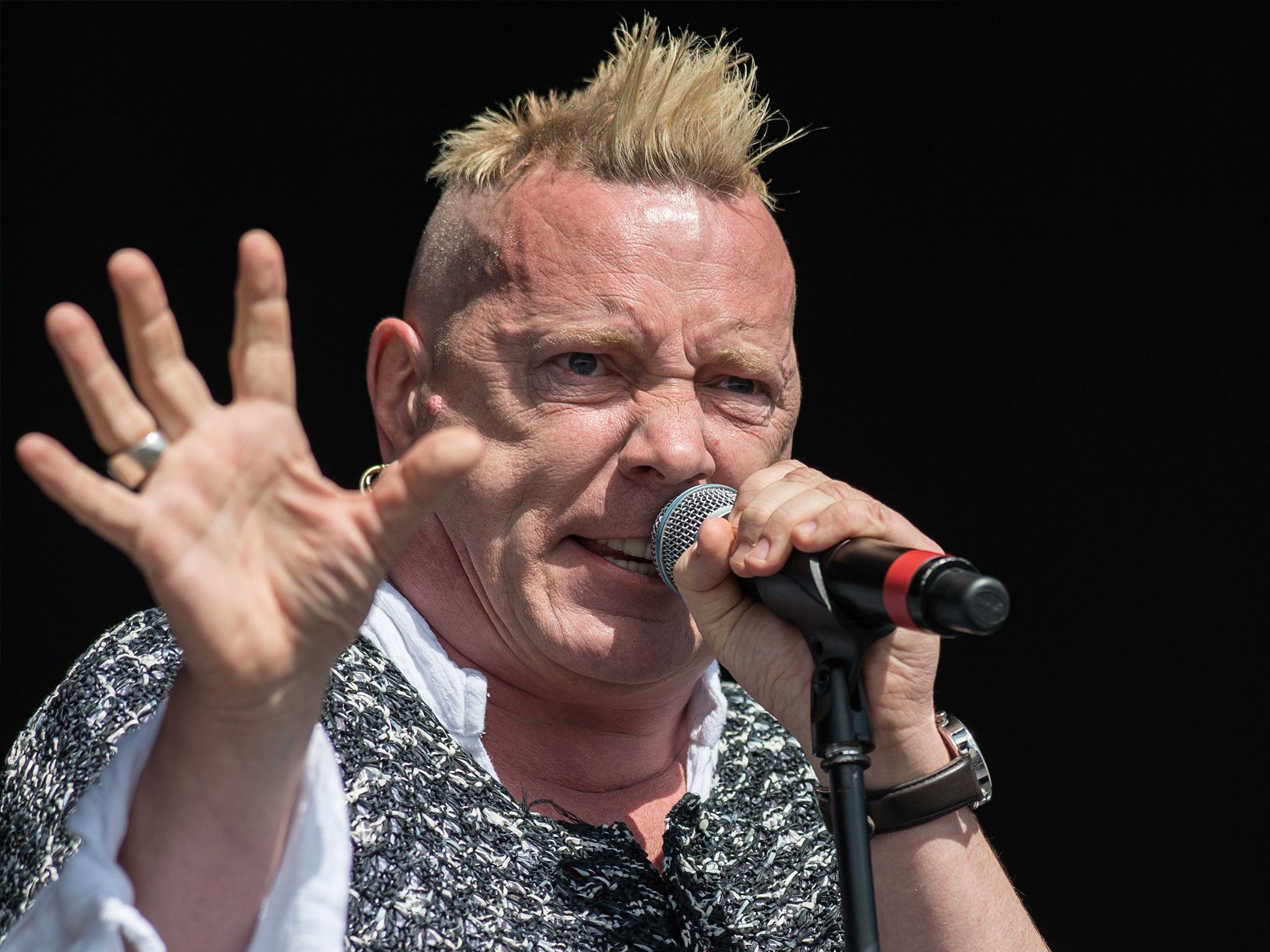 John Lydon performing as part of his band Public Image Ltd at the 2013 Glastonbury Festival