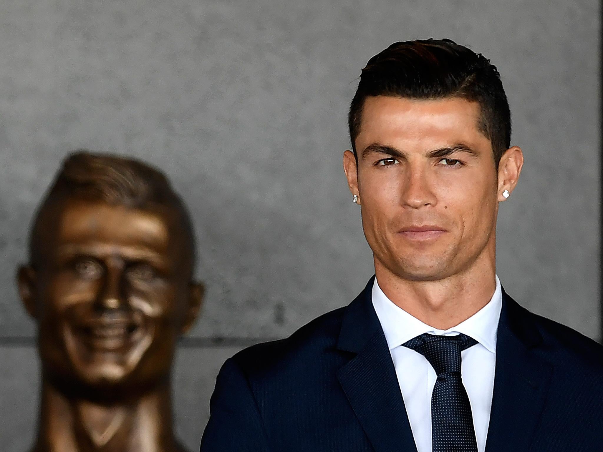 Despite the statue bearing little likeness to Ronaldo, he seemed pleased with it