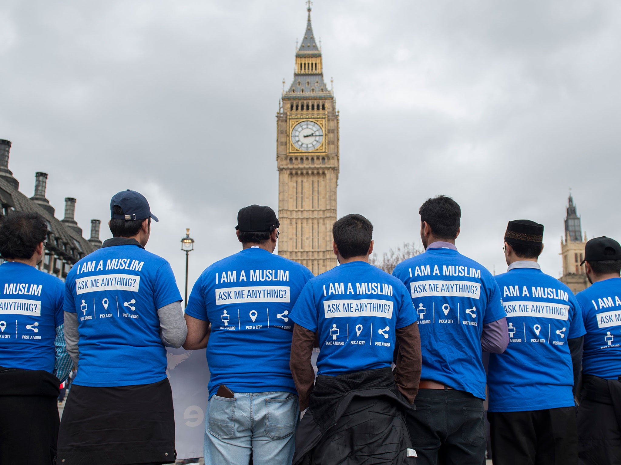 Members of the Ahmadiyya Muslim Association pay their respects in Parliament Square a week after the Westminster terror attack