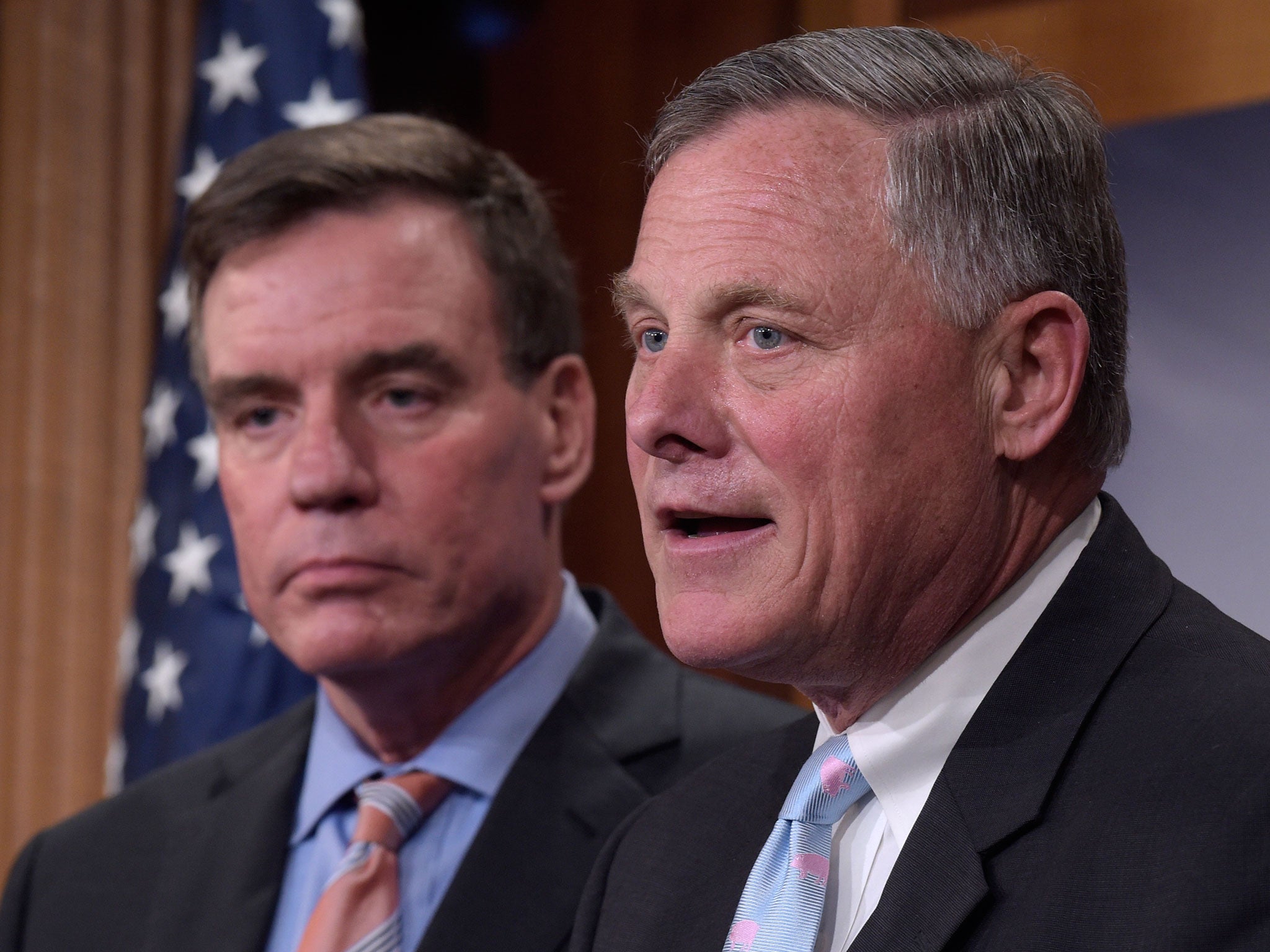 Senate Intelligence Committee Chairman Sen. Richard Burr, right, and the committee's Vice Chairman Sen. Mark Warner discuss the investigation into the possible Russian ties of Donald Trump's associates