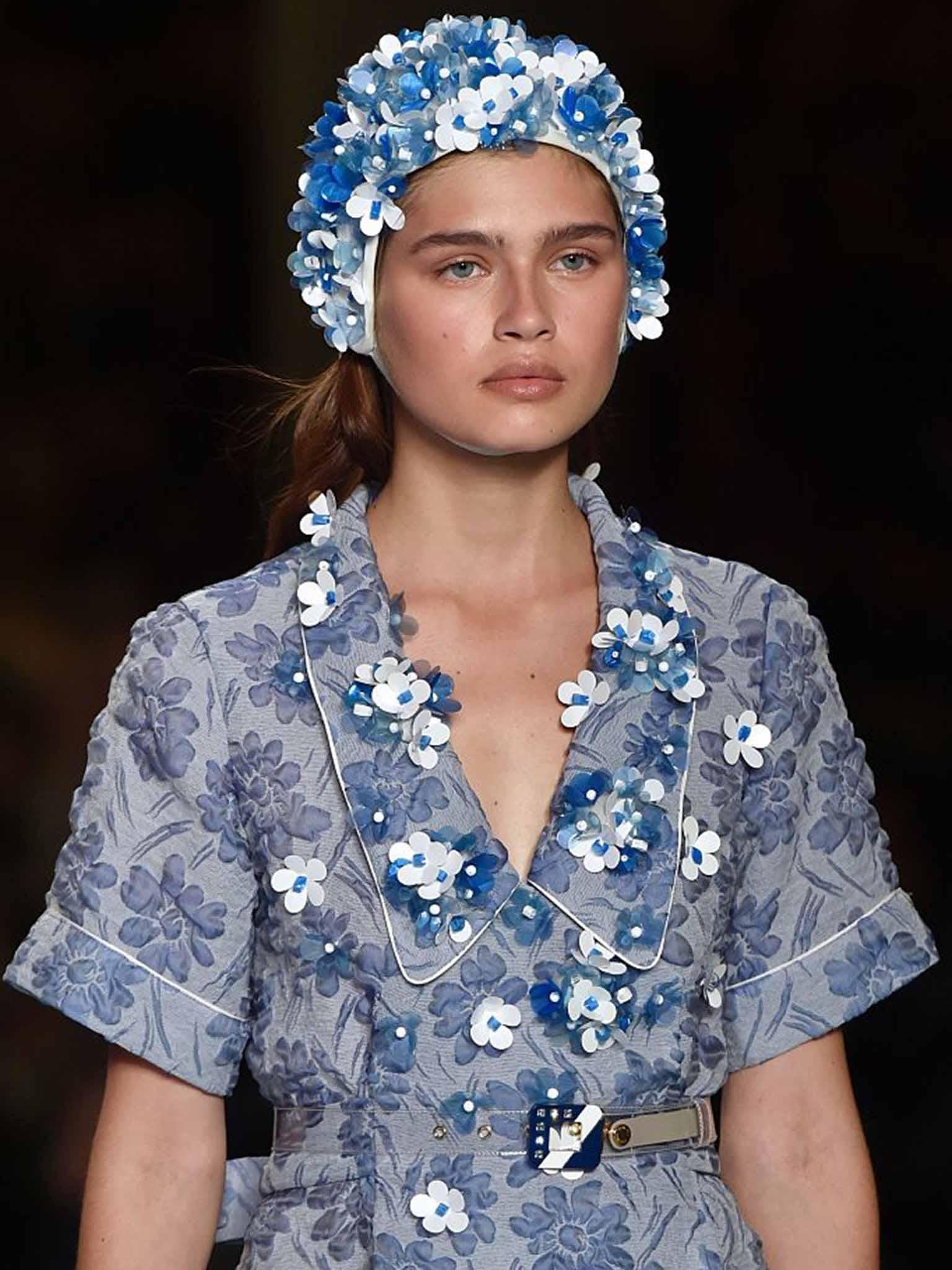 Miu Miu served up a retro seaside-inspired collection with 3D flower bathing caps, swimsuits and sliders (AFP/Getty)