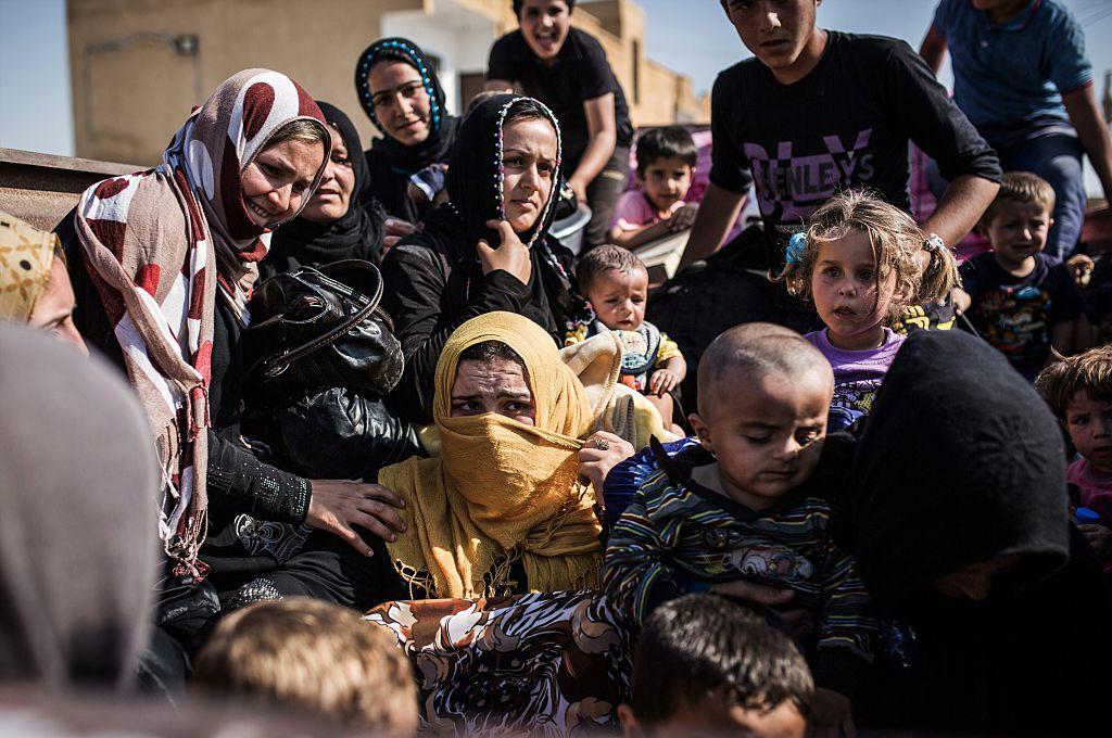 Syrian refugees from Raqqa governorate cross the Syria-Turkey border fleeing Isis in this file photo dated June 22 2015