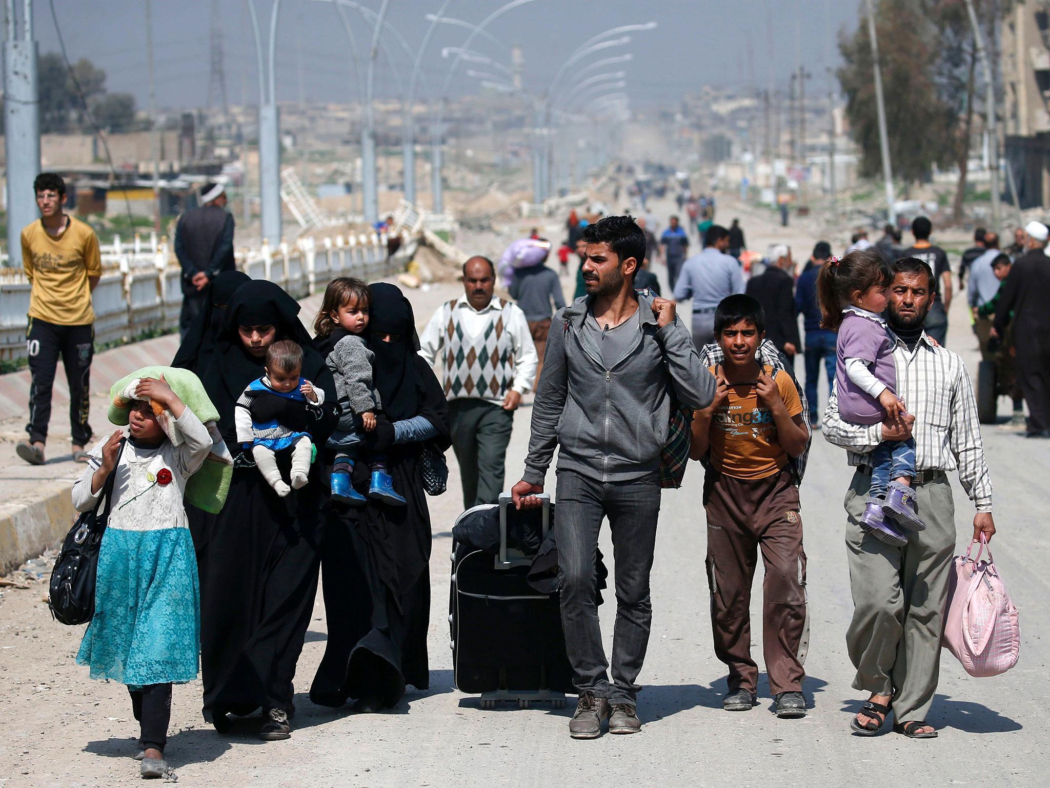 Residents flee their homes in the Old City. Some are not so lucky – one witness says he cannot leave his home for fear of being shot by militants