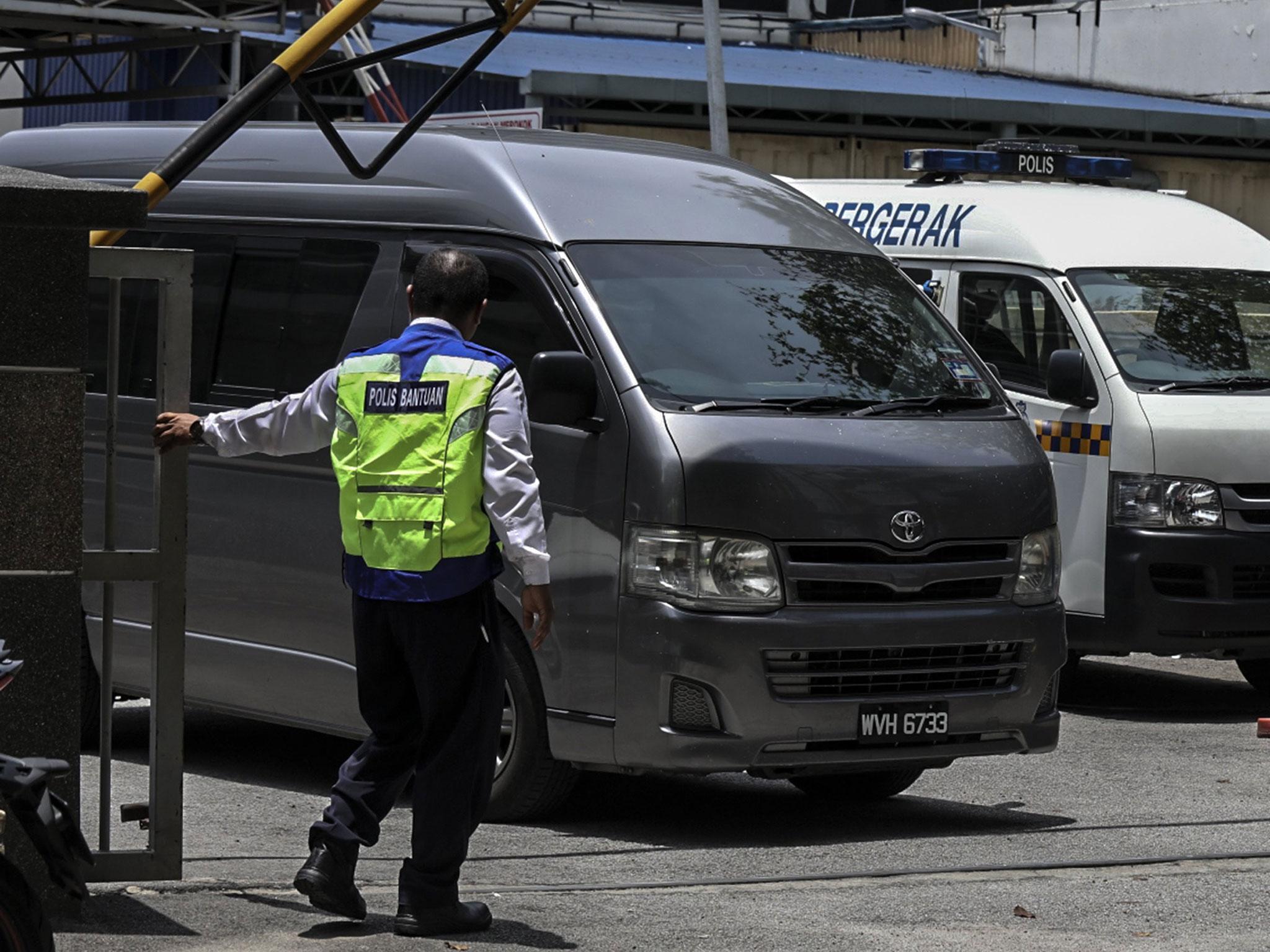 A van believed to be carrying the body of Kim Jong-un’s half brother was seen leaving a mortuary this morning