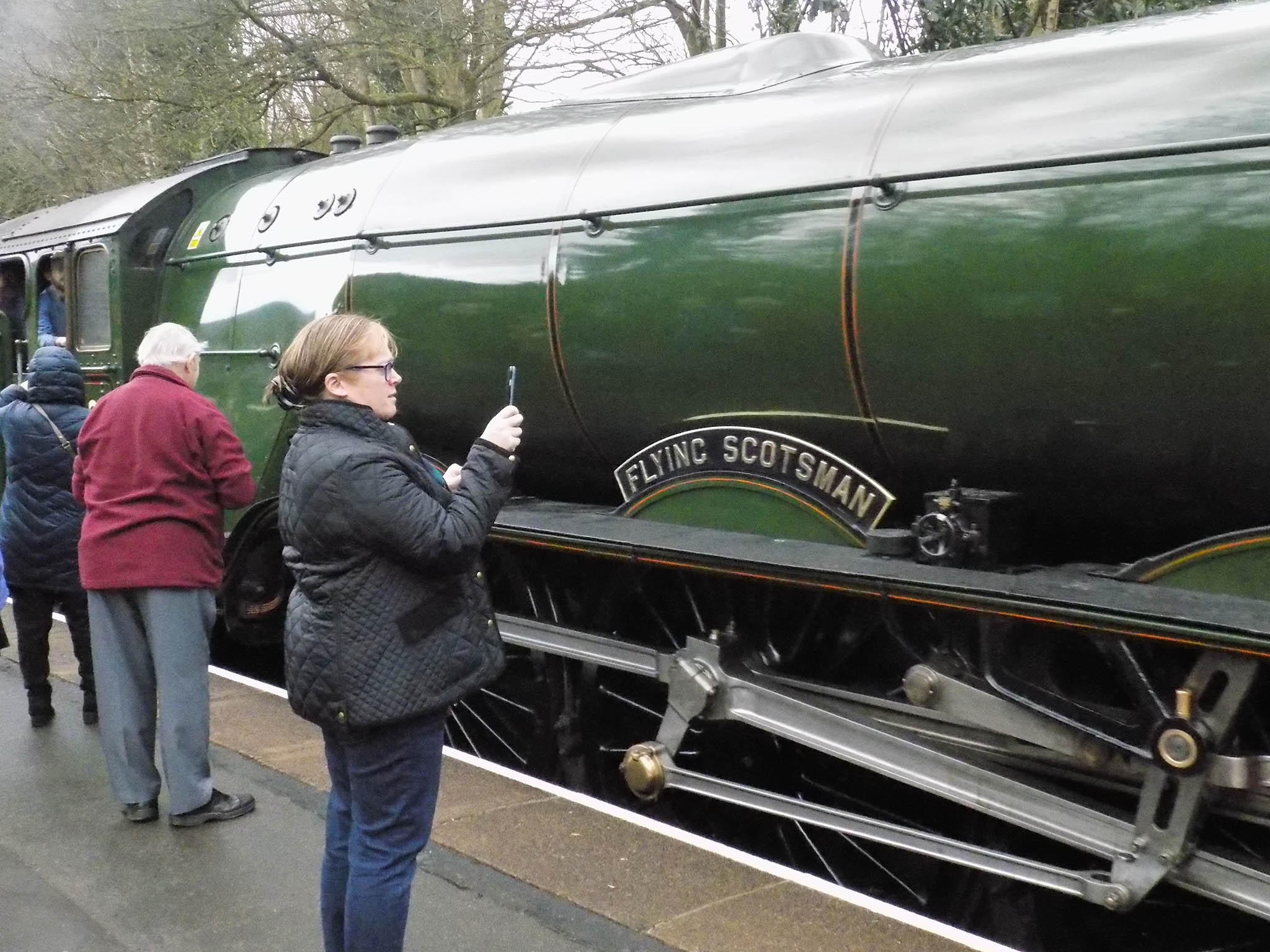 A steam enthusiast takes a picture of the historic train