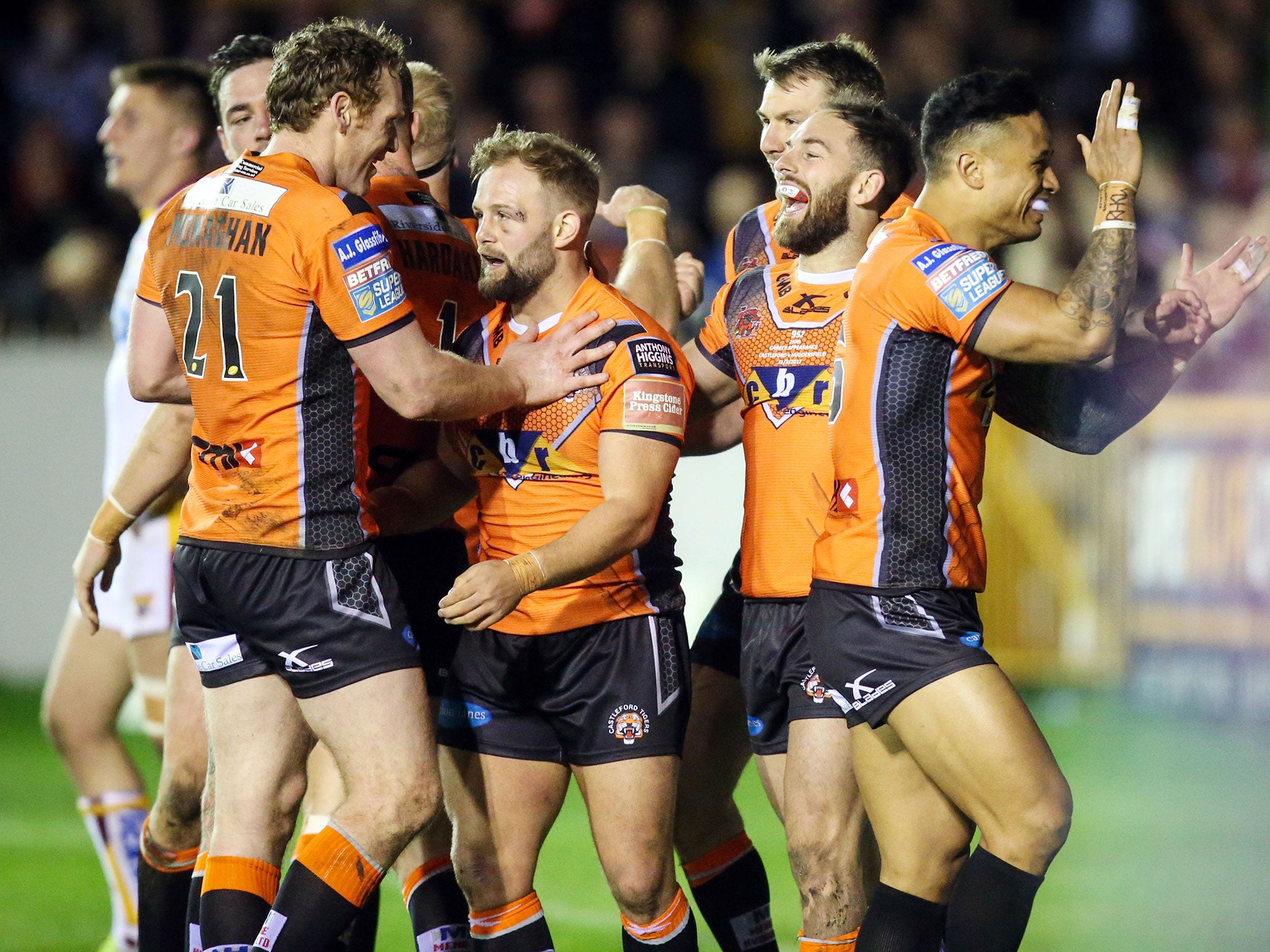 Luke Gale (2nd right) celebrates scoring for Castleford against Huddersfield Giants