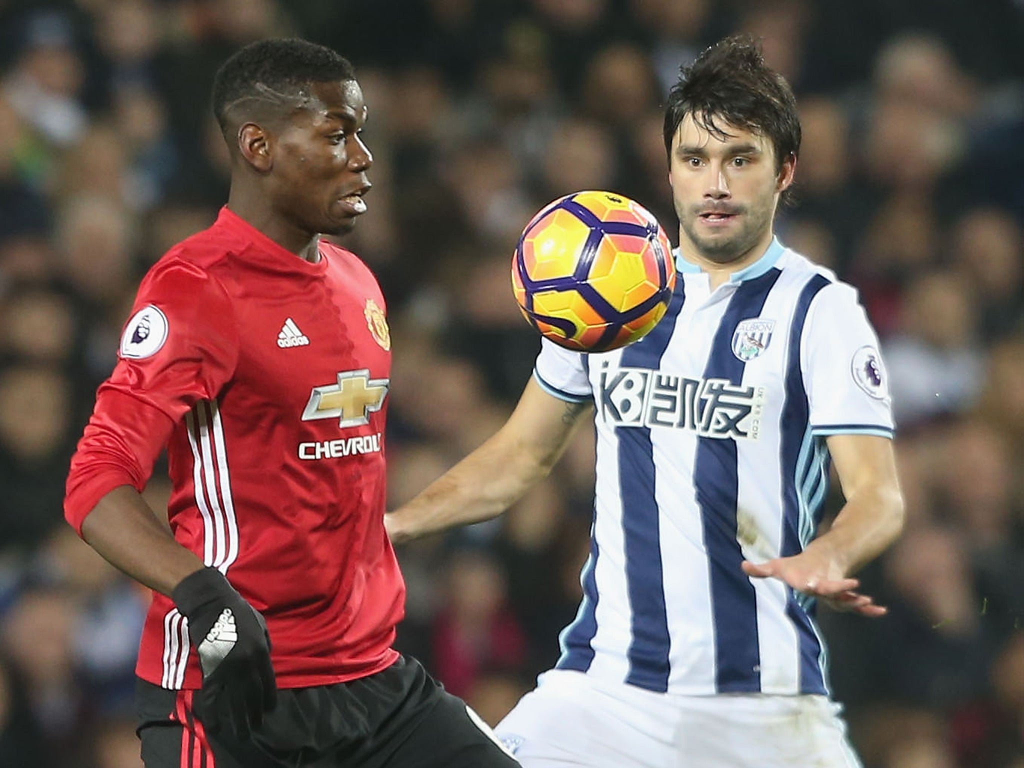 Paul Pogba and Claudio Yacob battle for the ball