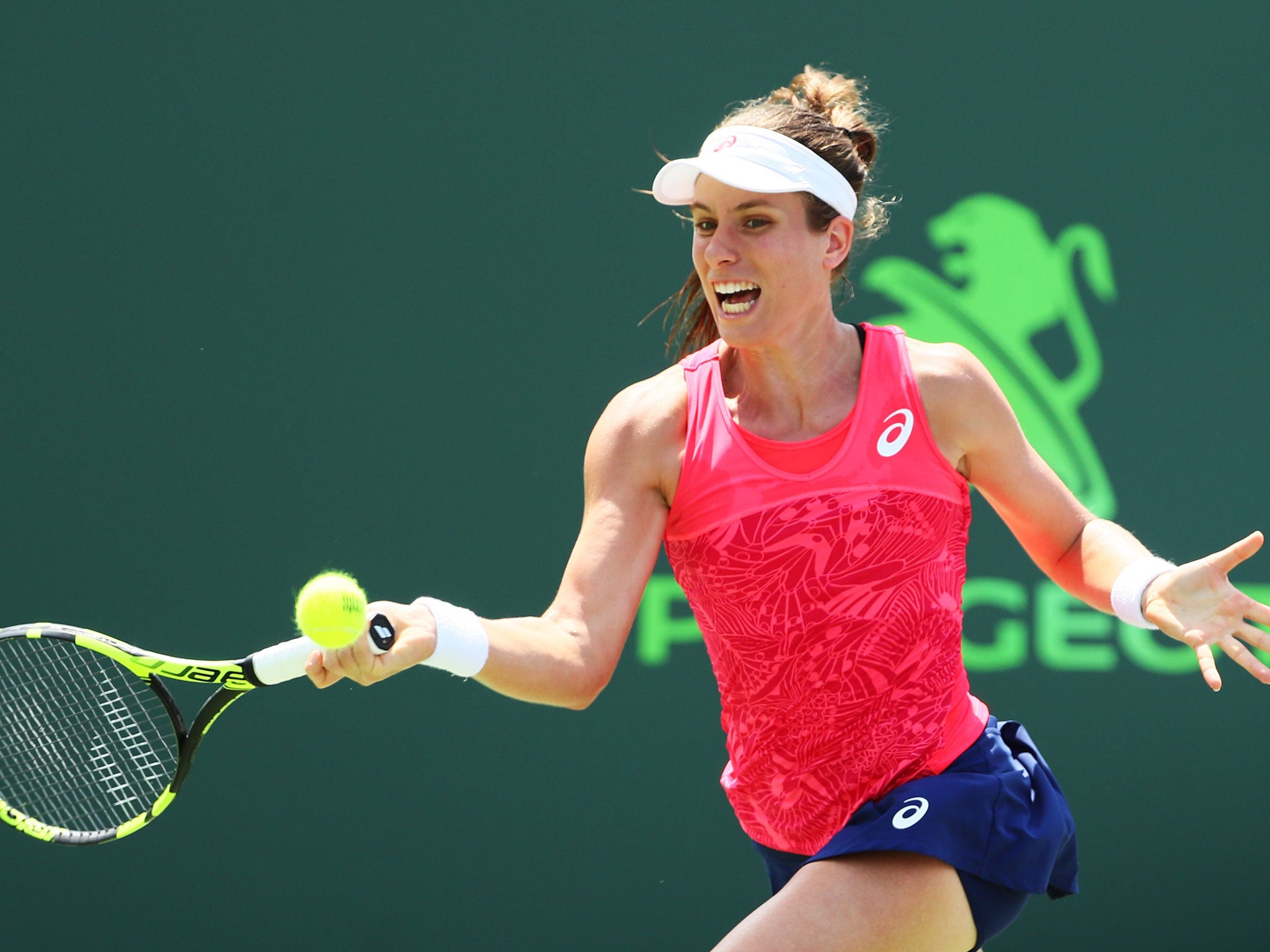 Konta returns a shot in the last set of the final