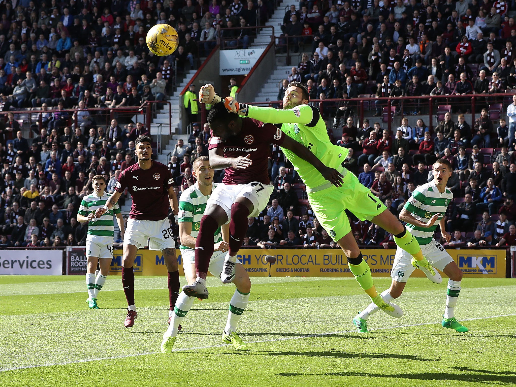 Esmael Goncalves of Hearts vies with Celtic goalkeeper Craig Gordon