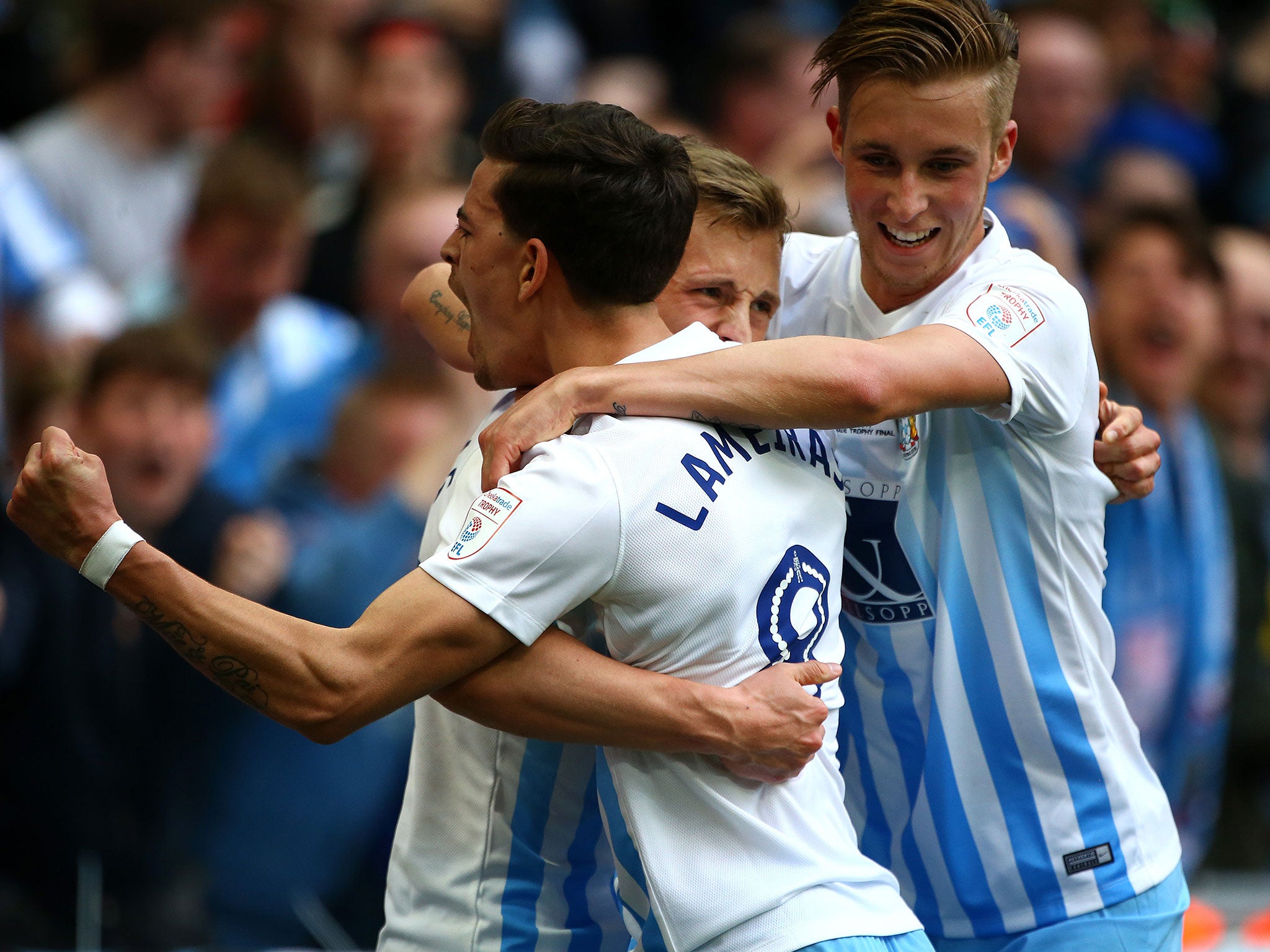 &#13;
Thomas celebrates with team mates Ruben Lameiras and Ben Stevenson after scoring his team's second goal &#13;