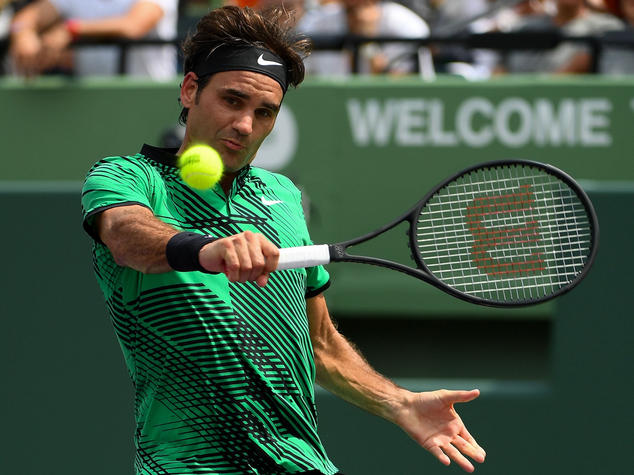 Federer in action against Nadal during Sunday's final in Miami