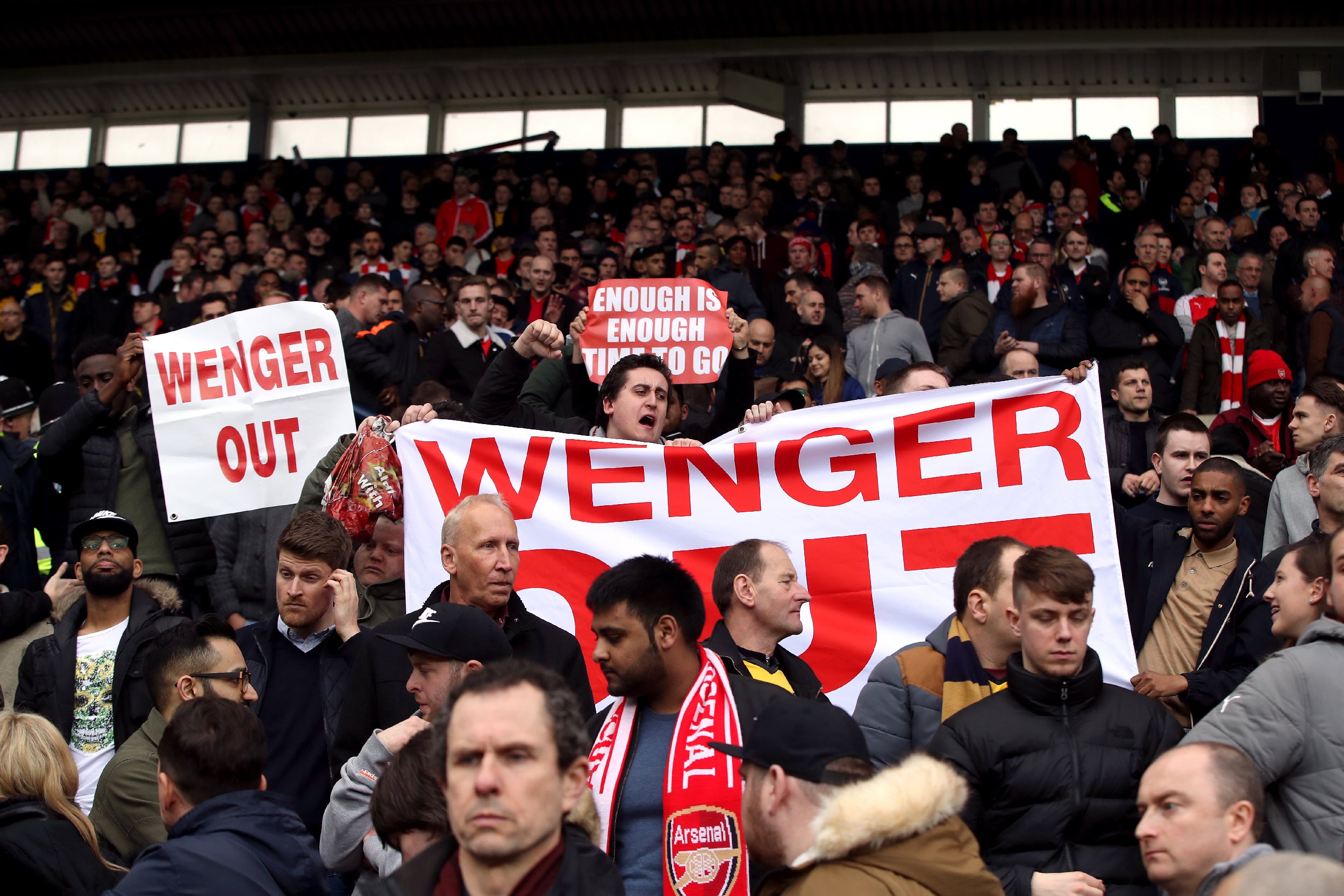 Arsenal fans are split on whether to stick or twist with the manager (PA)