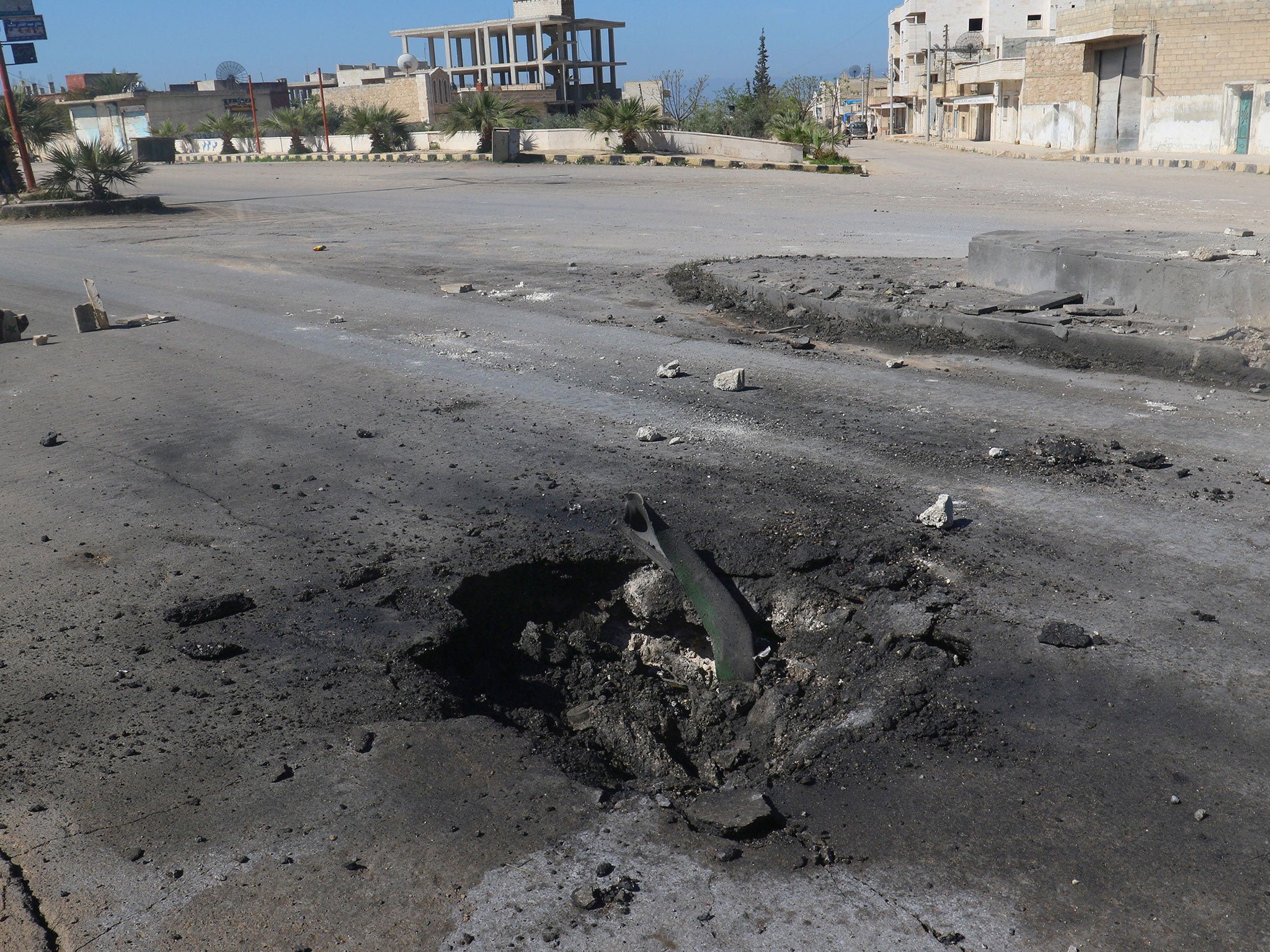 A crater is seen at the site of an air strike, after what rescue workers described as a suspected gas attack in the town of Khan Sheikhoun in rebel-held Idlib, Syria