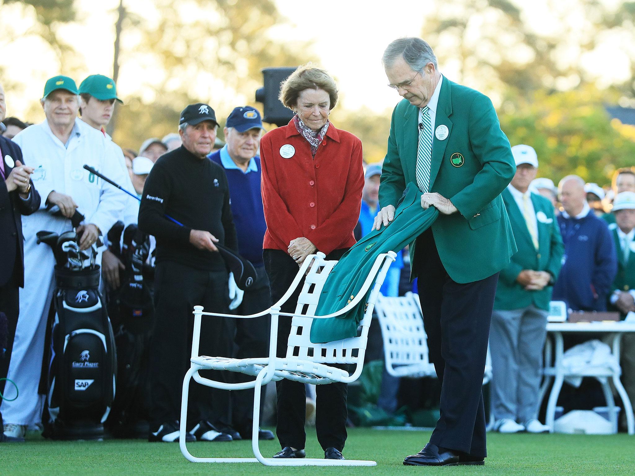 Arnold Palmer's Green Jacket is placed in a white chair next to the first tee box at Augusta.