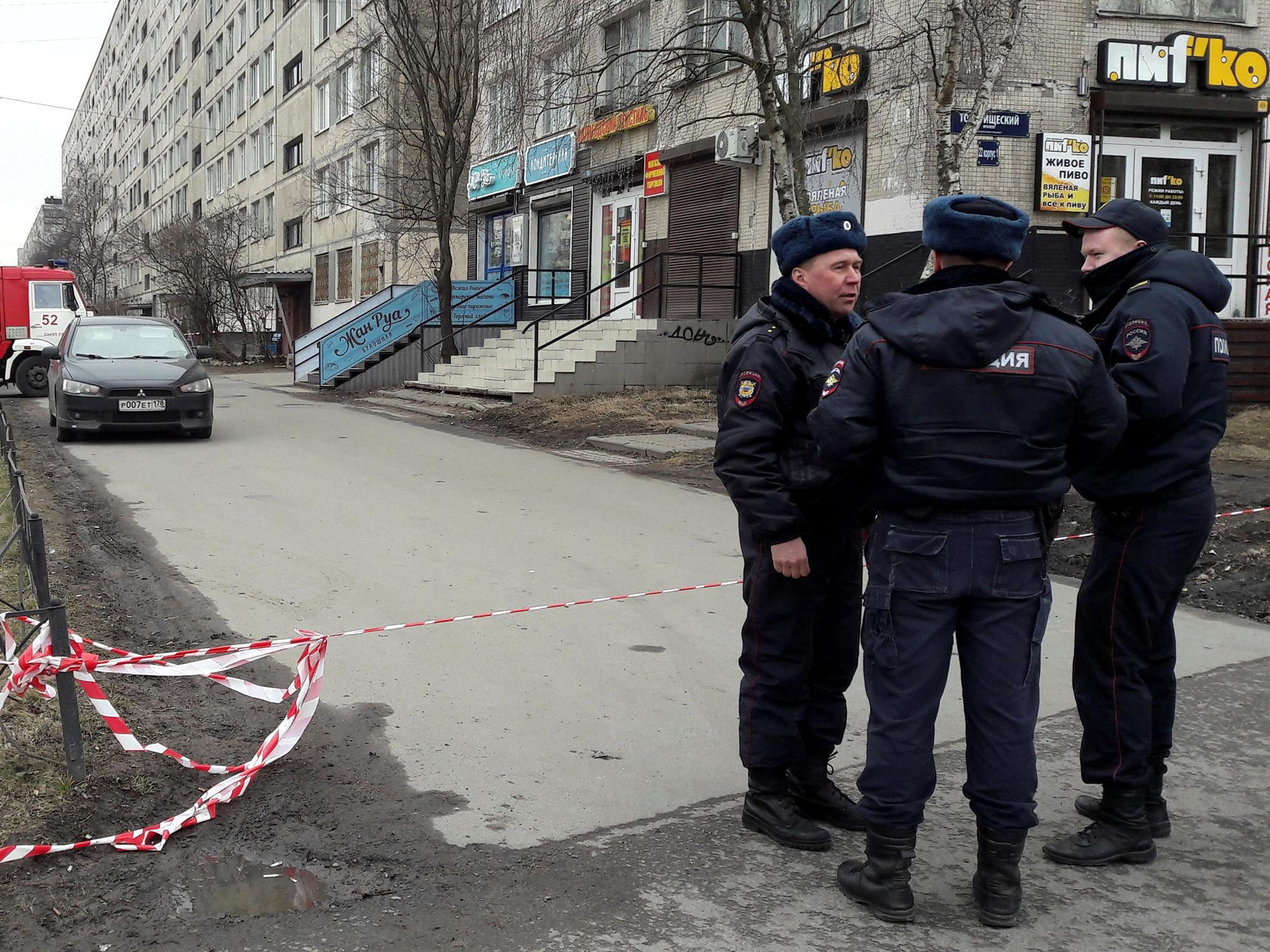 Russian police officers secure a residential area in St Petersburg