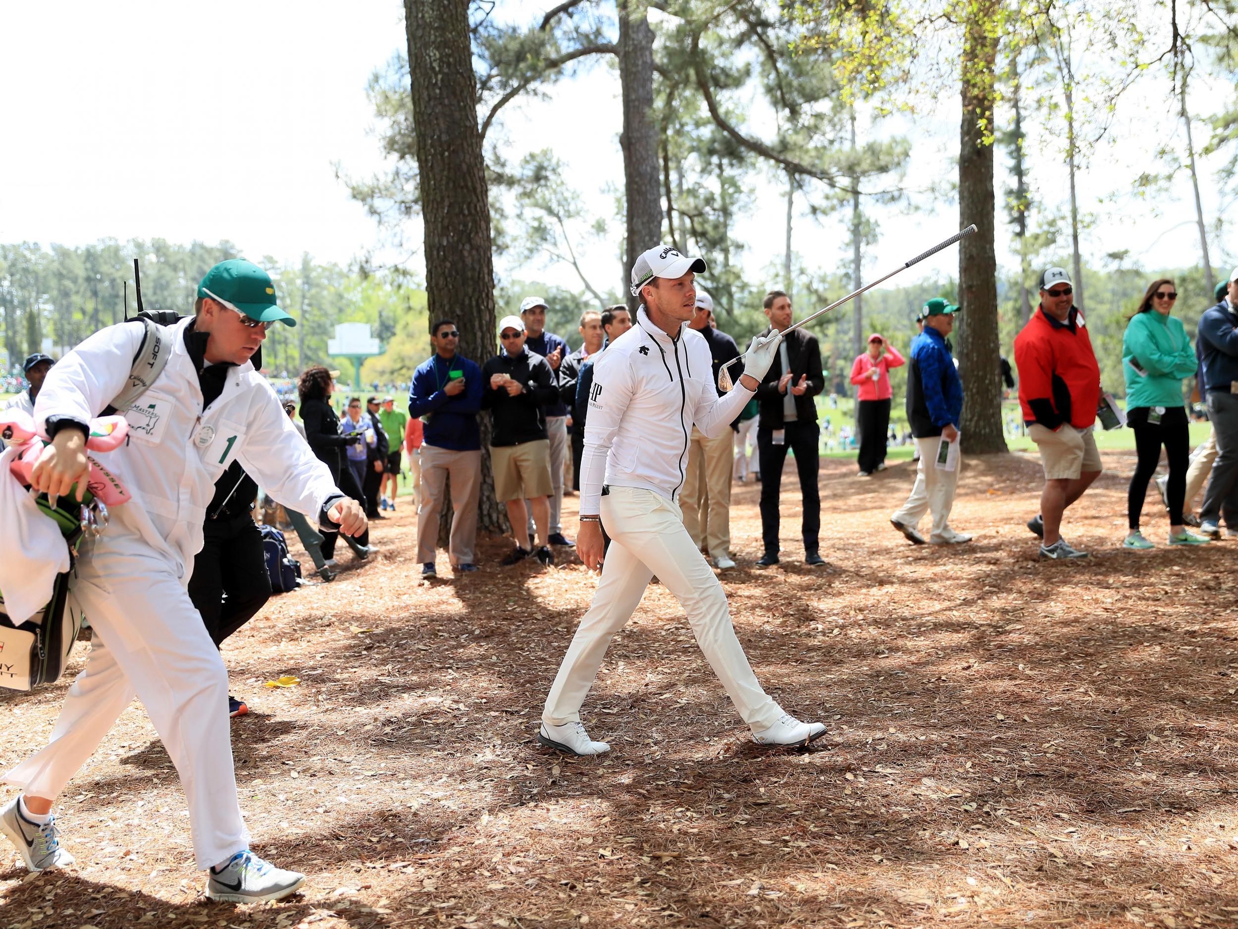 The reigning champions battled back to save his round (Getty)