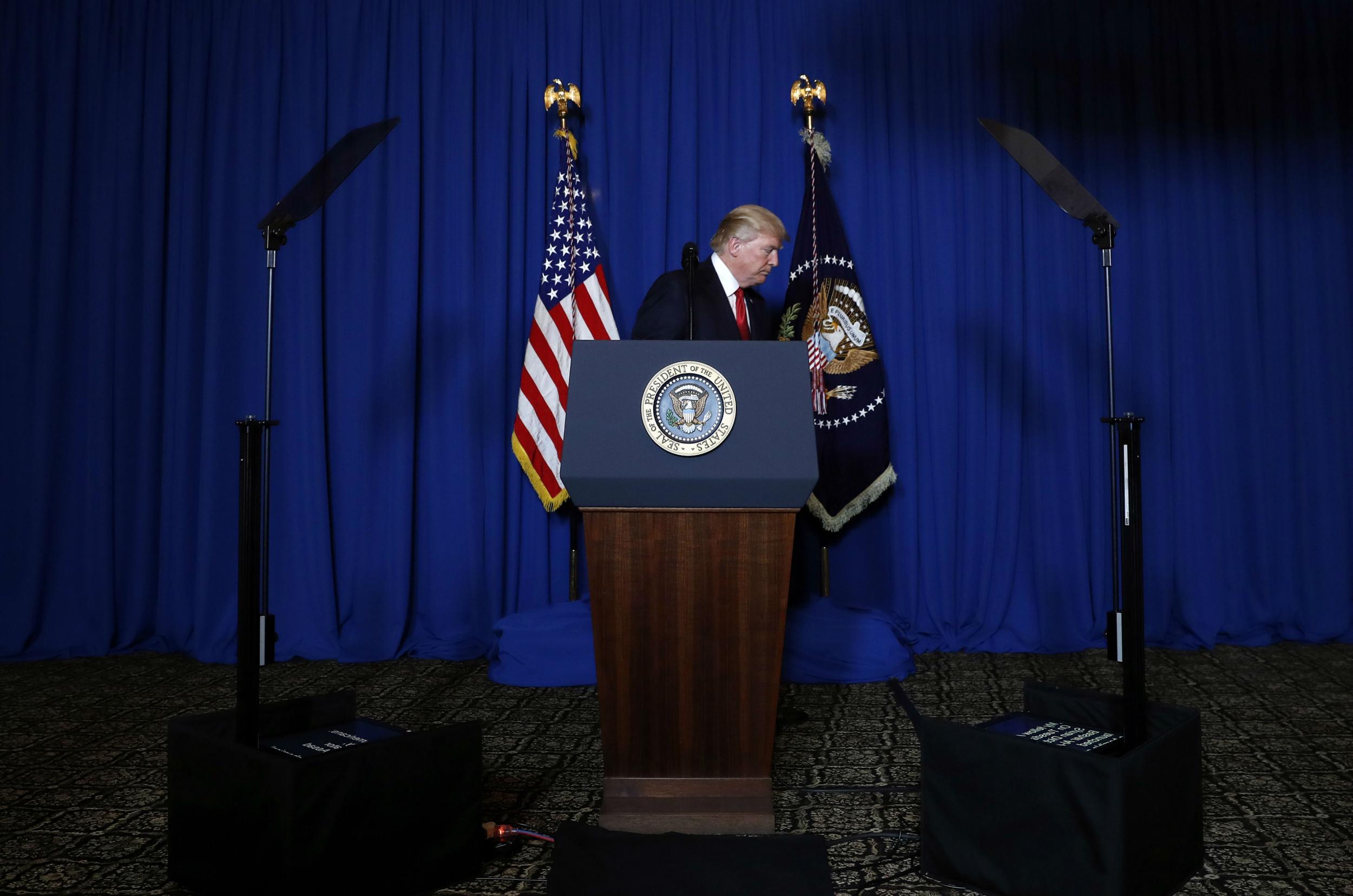 Trump walks away from the podium at Mar-a-Lago after announcing strikes