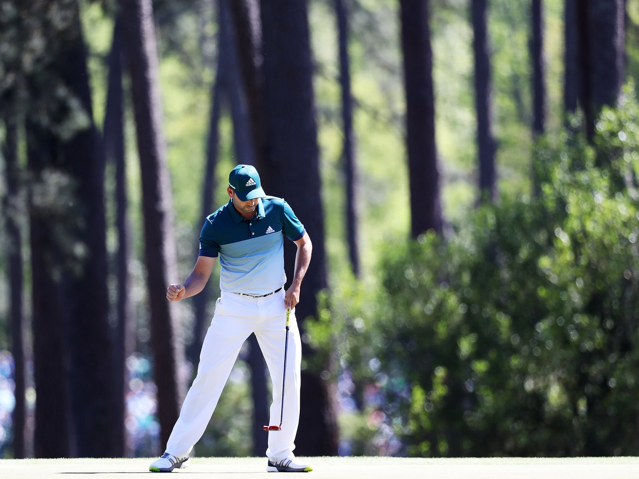 Garcia celebrates his birdie on the third