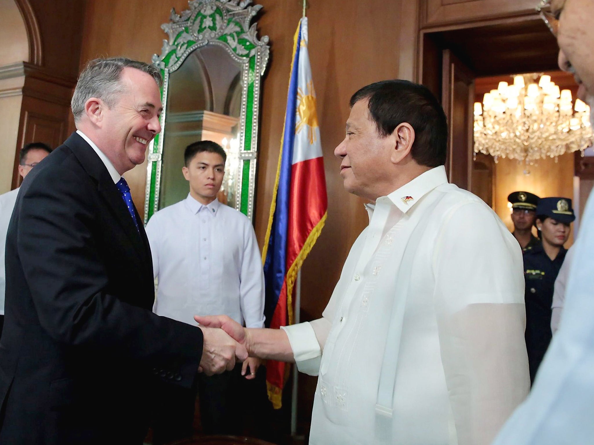 Liam Fox greets self-confessed murderer and international pariah President Duterte with a warm handshake