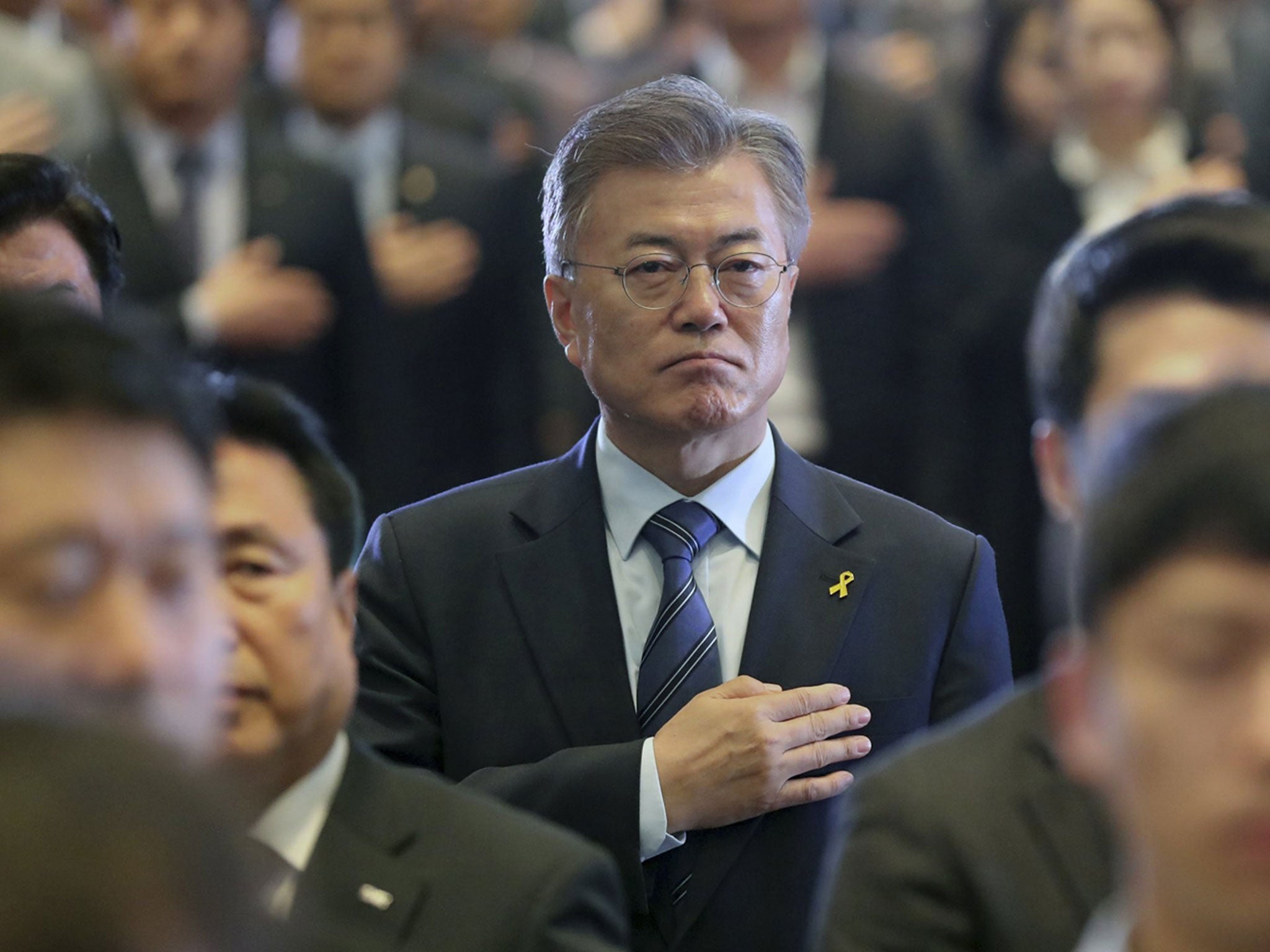 Heart and Seoul: Moon Jae-in, the presidential candidate of the Liberal Democratic Party of Korea, salutes the national flag