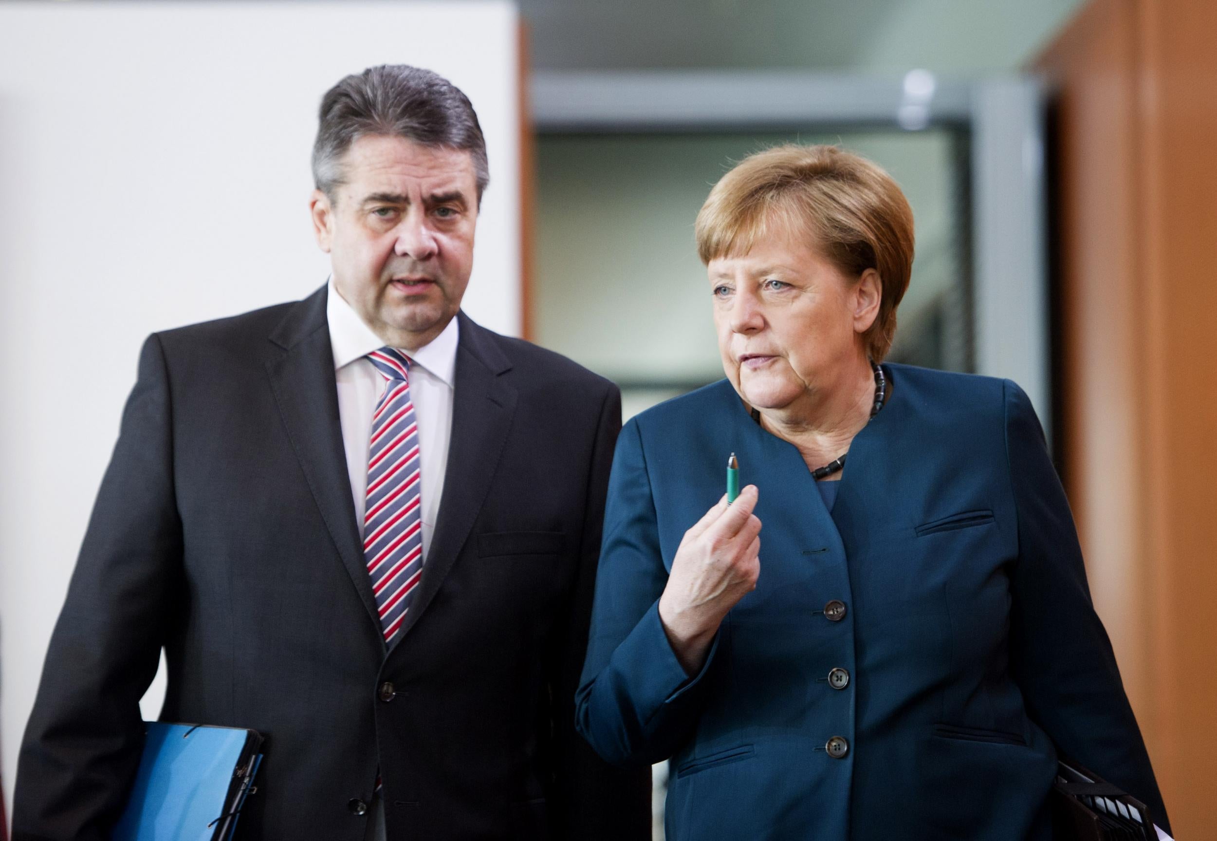 Mr Gabriel (above, with Angela Merkel) foresaw a ‘new, closer form of customs union’ with Turkey