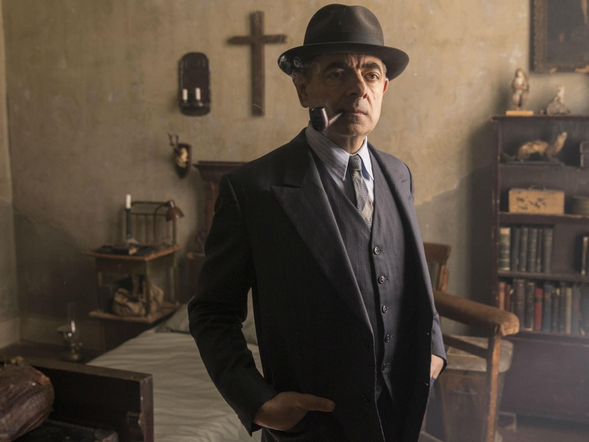 Rowan Atkinson playing the pipe-smoking French detective Maigret in ITV's 'Maigret's Night at the Crossroads'