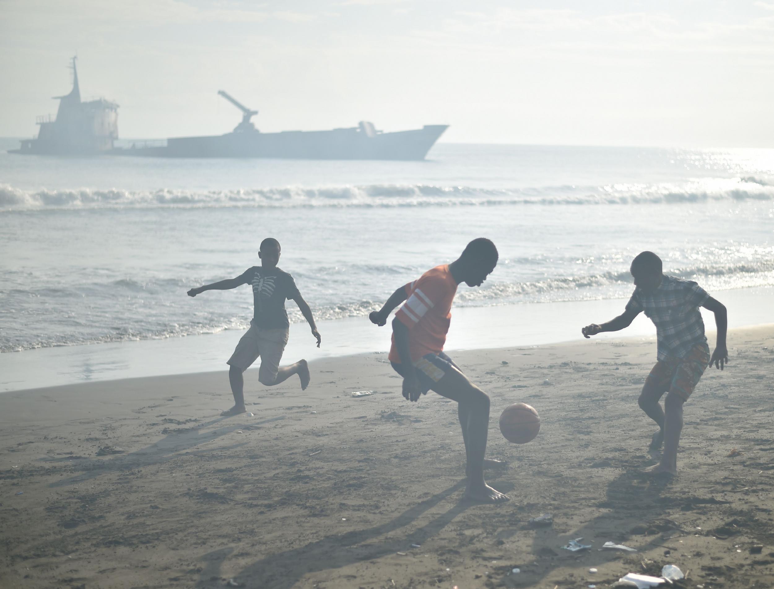 Children play on the beach in Haiti