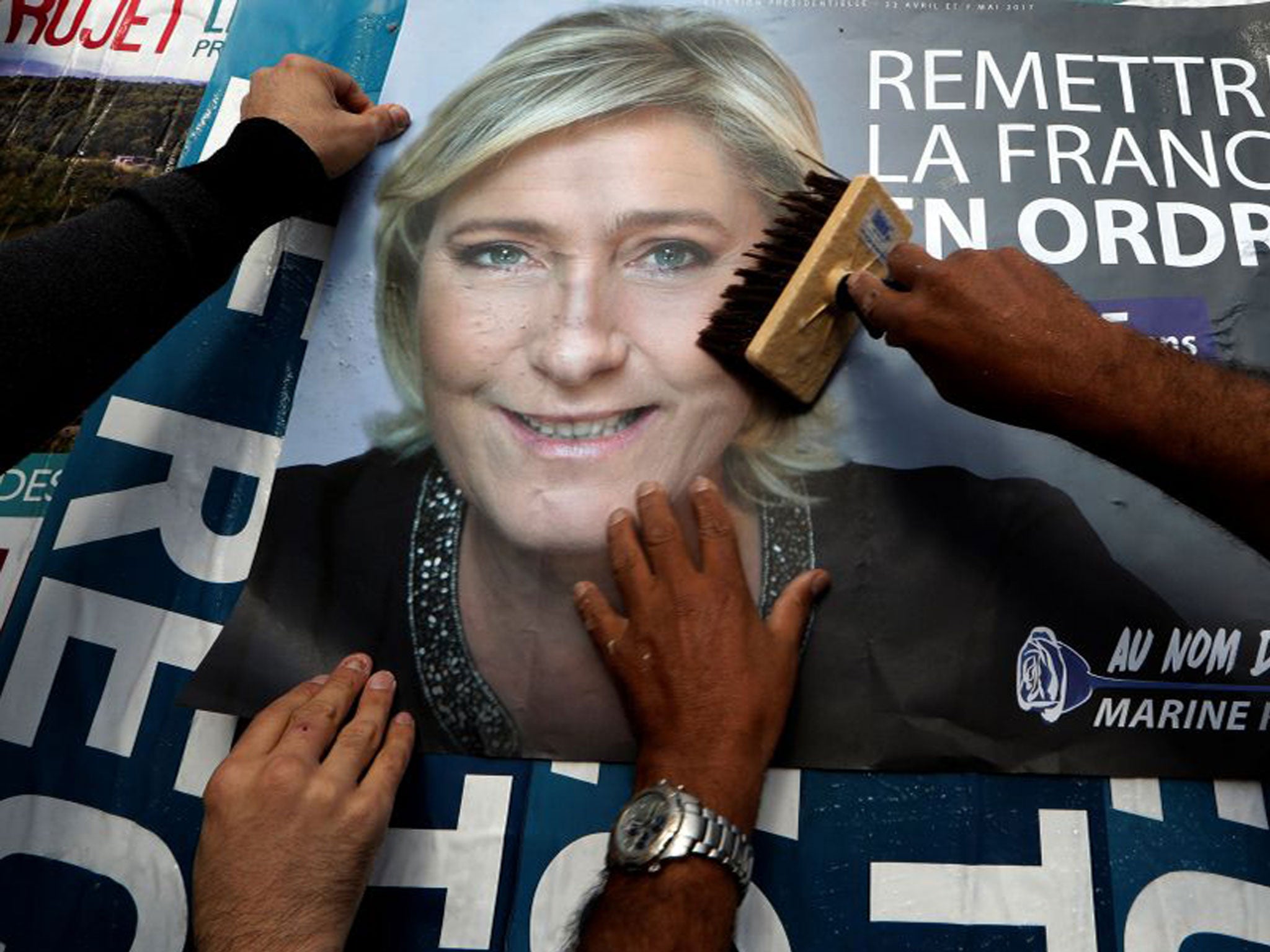 A billboard poster for French National Front leader Marine Le Pen in Antibes. After Sunday's vote, she will face a run-off with Emmanuel Macron on 7 May