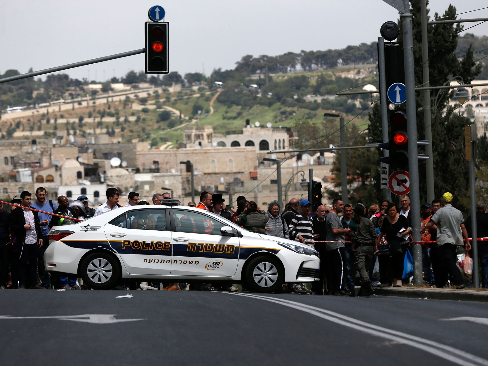 A crowd formed at the scene of the attack. The Old City was packed with people as Jews marked Passover and Christians celebrated Easter