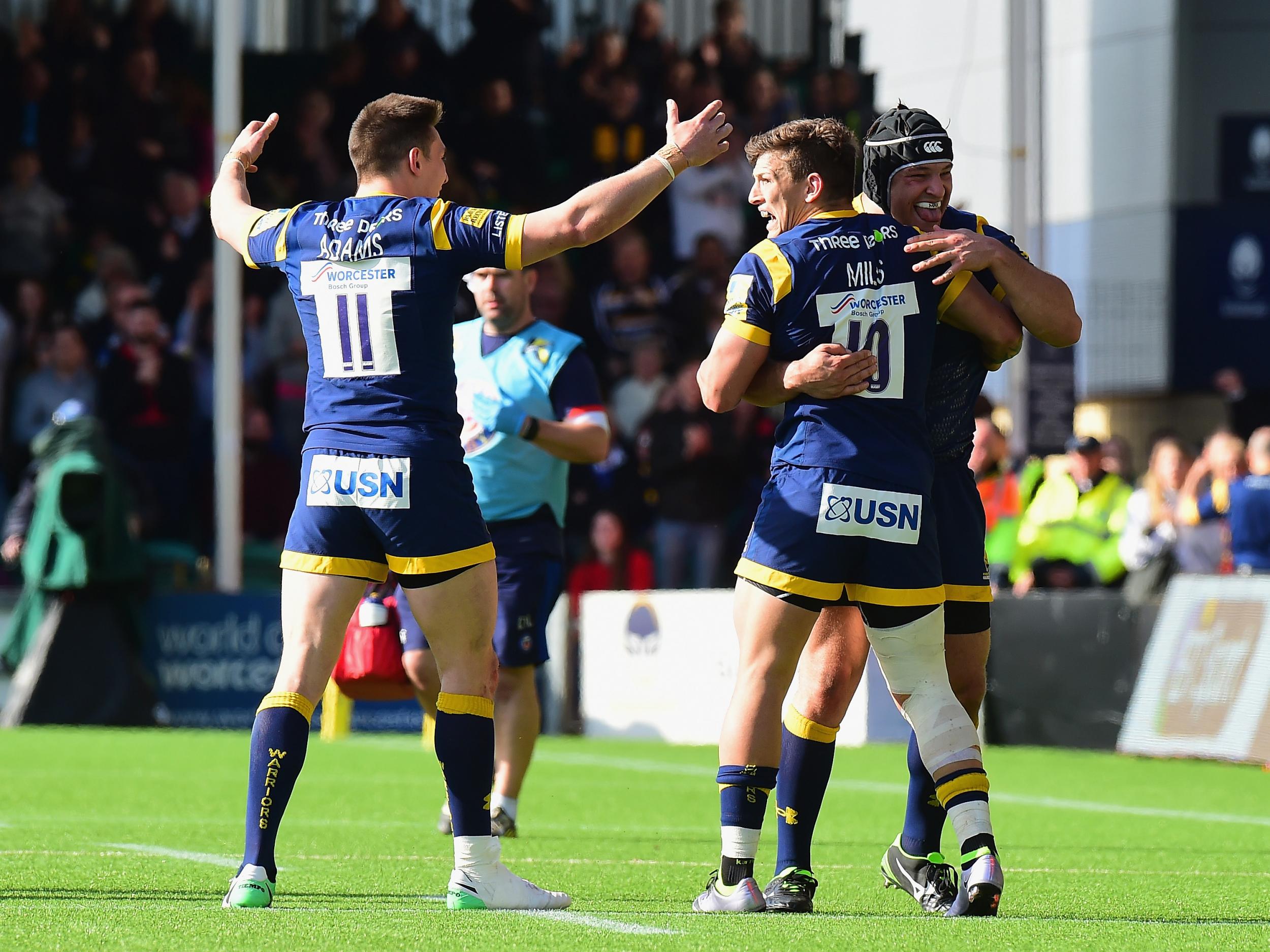 Josh Adams, Ryan Mills and Joe Taufetee celebrate